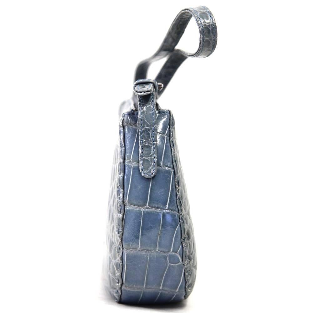 This baby blue crocodile leather purse is extremely classy. Designed by famous Roman luxury leather brand Dotti, it is a very luxurious yet easy piece to add to your wardrobe. Closes with a zip. Features one zip pocket in the inside.
Good