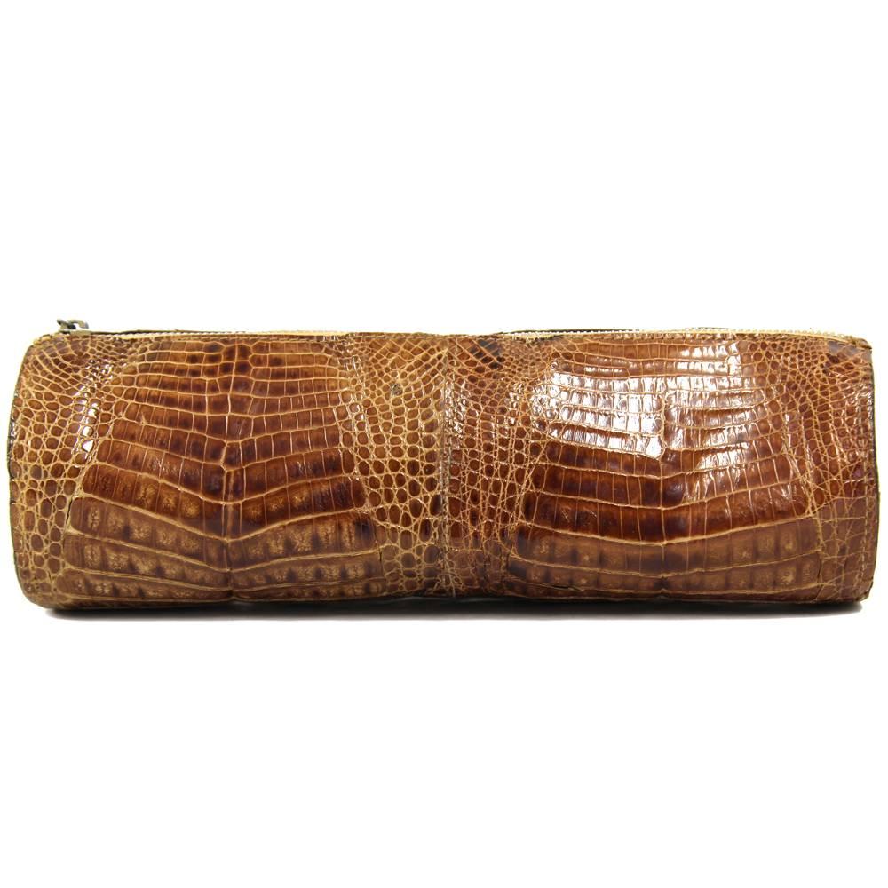 Very classy and chic pouch in caramel baby crocodile leather from the 1970s. Very soft brown leather lining. Closes with a zip. Good conditions, it does show minor signs of wear though.
PLEASE NOTE: This item cannot be shipped outside the European