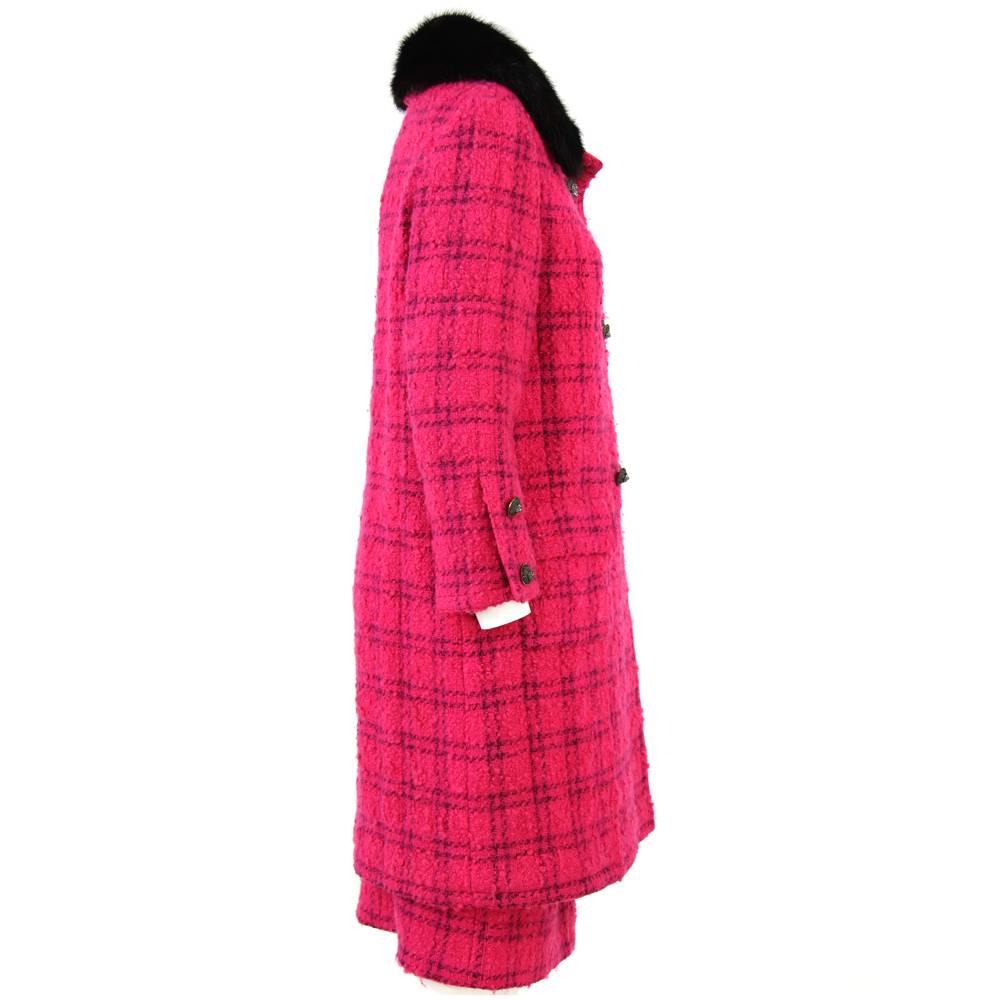 Adorable Chanel Couture two-piece suit in shocking pink wool, featuring a luxurious black fur collar. This piece is absolutely unique since it was authorized from Chanel in tailoring and fabrics but was custom-made for a client by the fine Italian