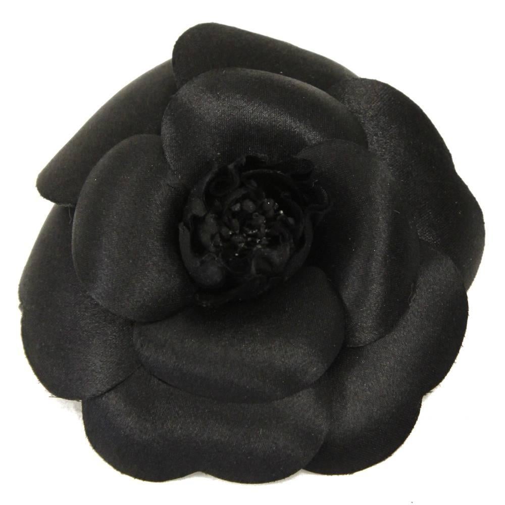 Elegant Chanel black fabric camellia Lapel pin, an iconic symbol of her style. The item is in excellent condition. 
Length: 9 cm