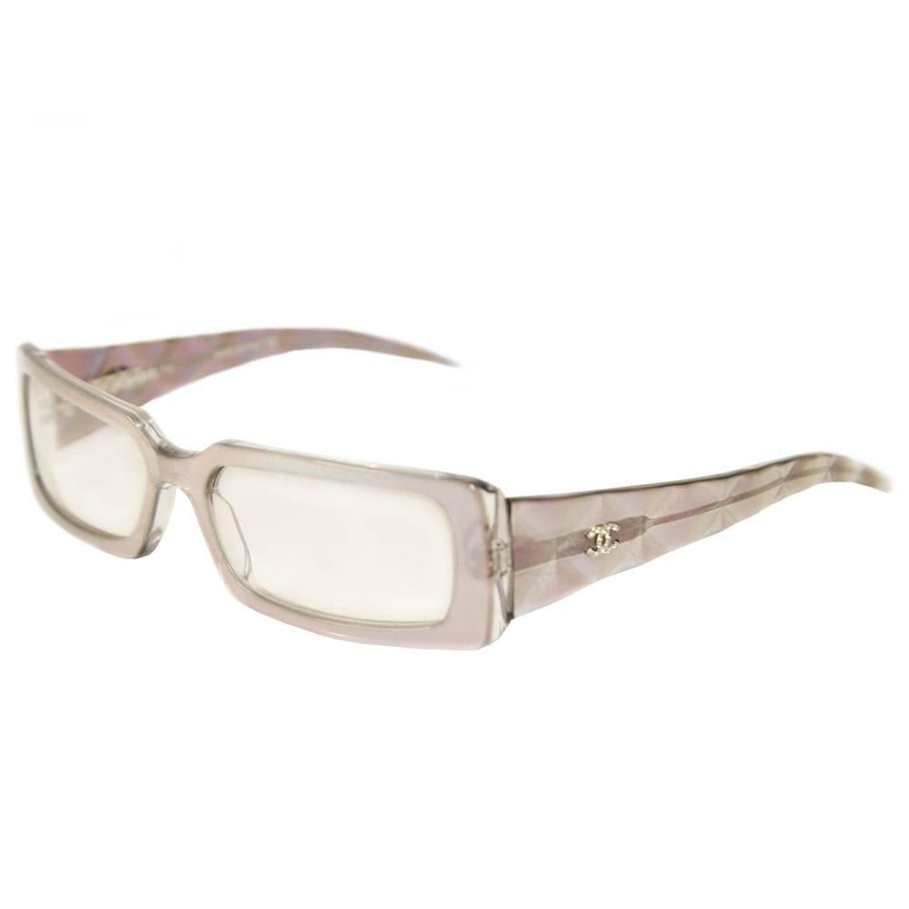 Beautiful Chanel iridescent acetate glasses with square lenses and rhinestones logo on the glasses temples. The item was produced in the 2000s and is in excellent conditions.  It includes the original case in a mother-of-pearl color, that shows