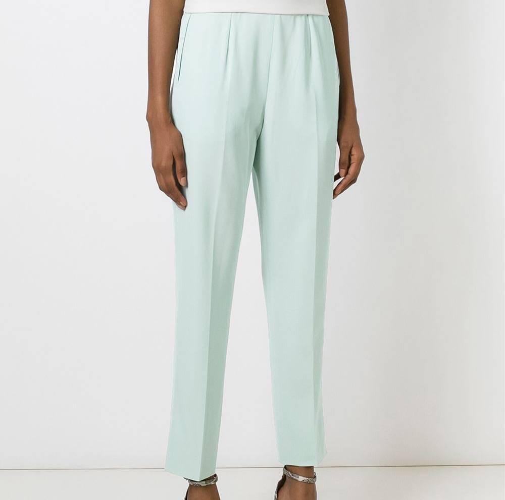 Beautiful mint light-blue wool high waist trousers from Céline. They features a waistband, two inset pockets to the sides and a tapered leg. The item is vintage, it was produced in the 80s and is in excellent conditions. 
 
Size: 38 FR

Lenght: 99