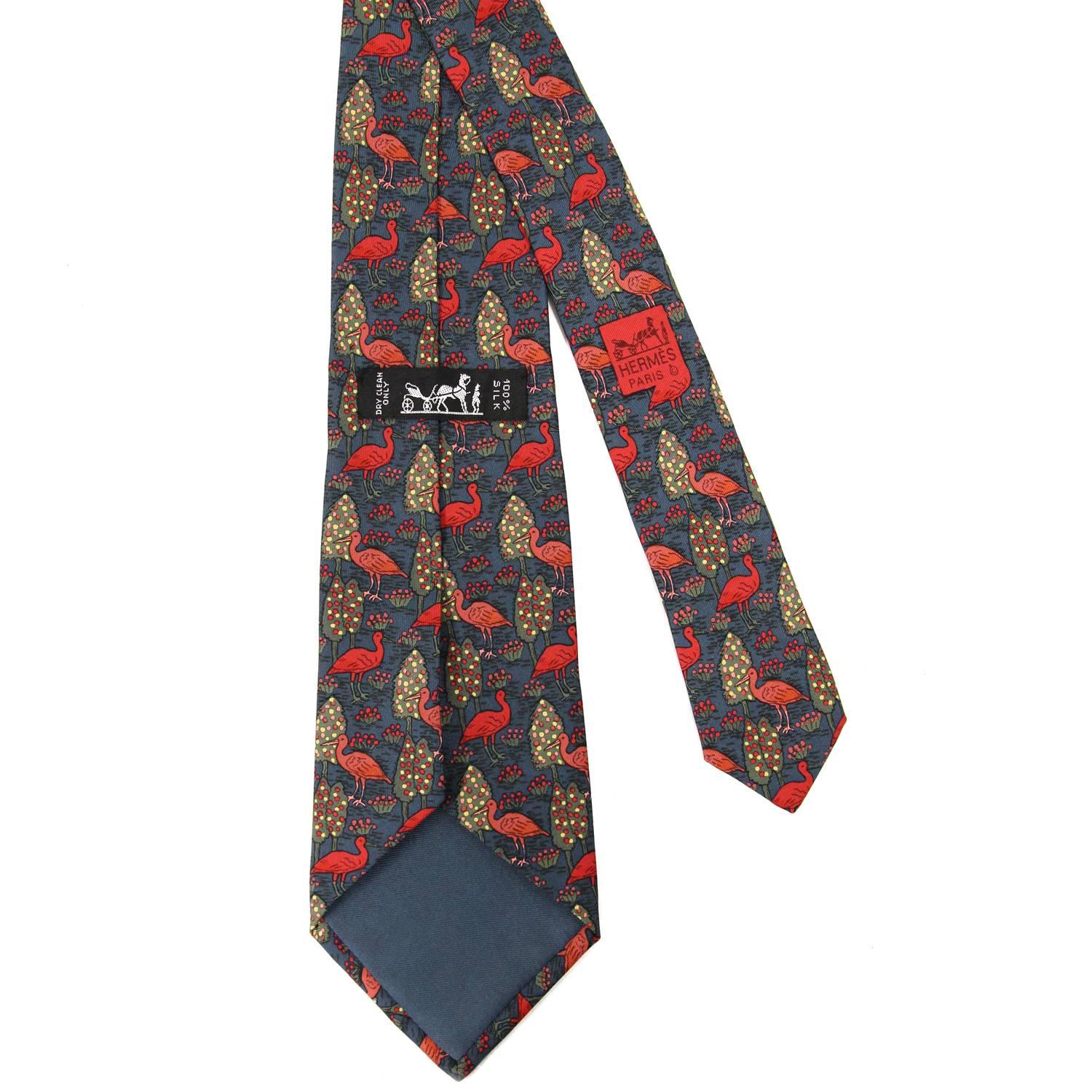 Lively Hermès 100% printed silk tie with a multicolor pattern of red herons and orchards. The item is vintage and is in excellent conditions, flawless. 
Width: 8 cm
