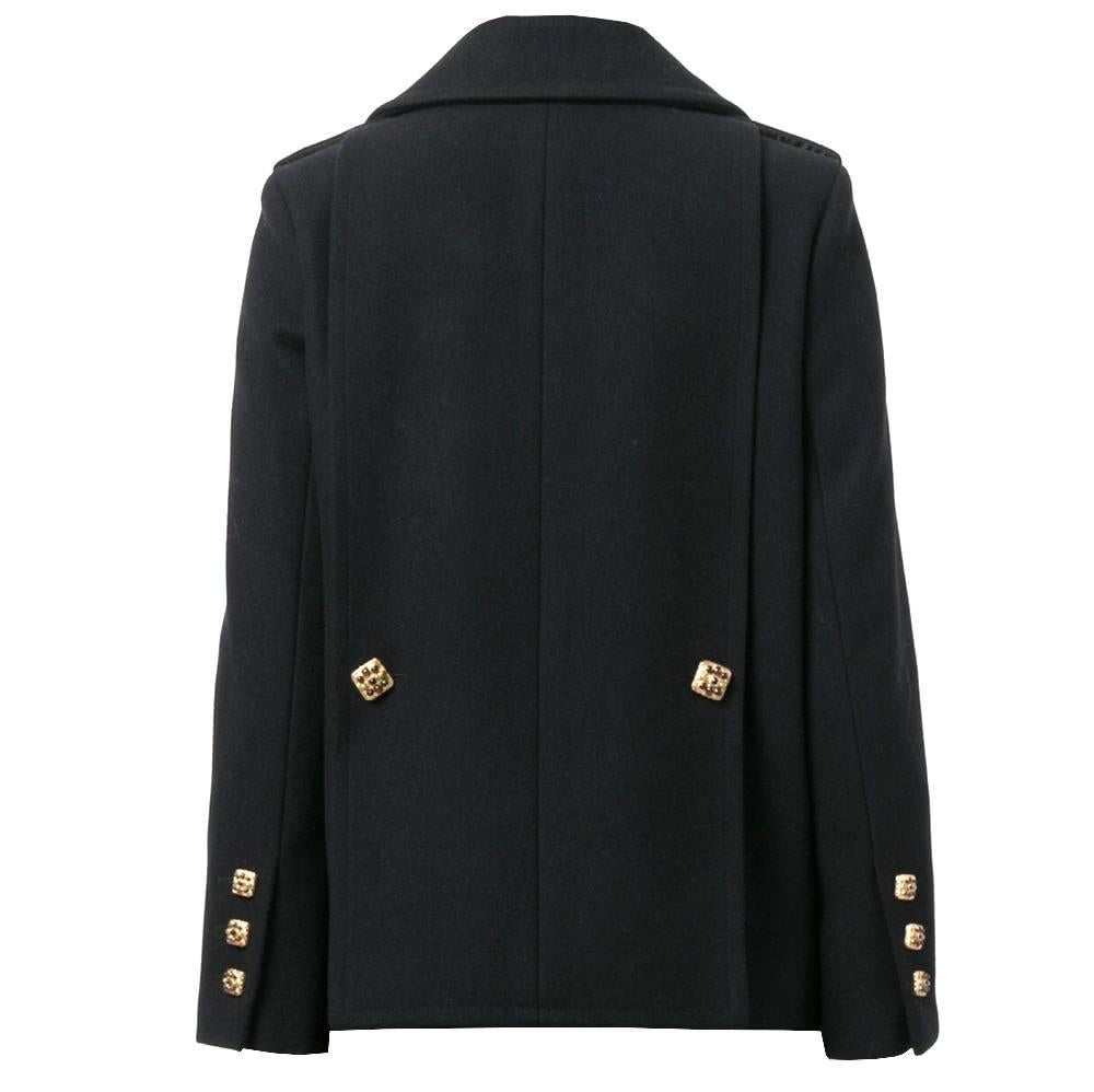 Elegant Chanel black wool embellished-button peacoat. It features a notched collar, long sleeves, button cuffs, a double breasted front fastening, side pockets, a short length, a loose fit and gold-tone buttons with multicolored stones. The item is