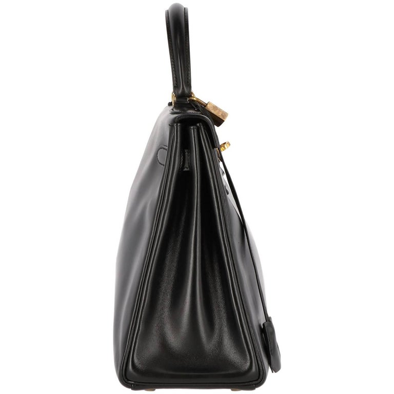 Lot 9 - An Hermès black Fjord leather Kelly bag, 1995