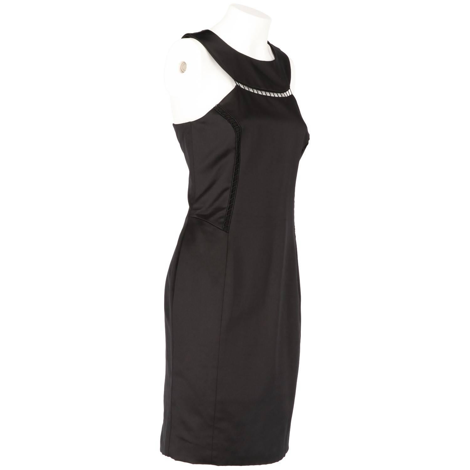 Elegant Givenchy blend silk satin midi dress in black. It features a fitted shape, no sleeves, and is embellished both on the front and the back with a distinctive cut-out décolleté, which recalls the iconic Givenchy dress worn by Audrey Hepburn in