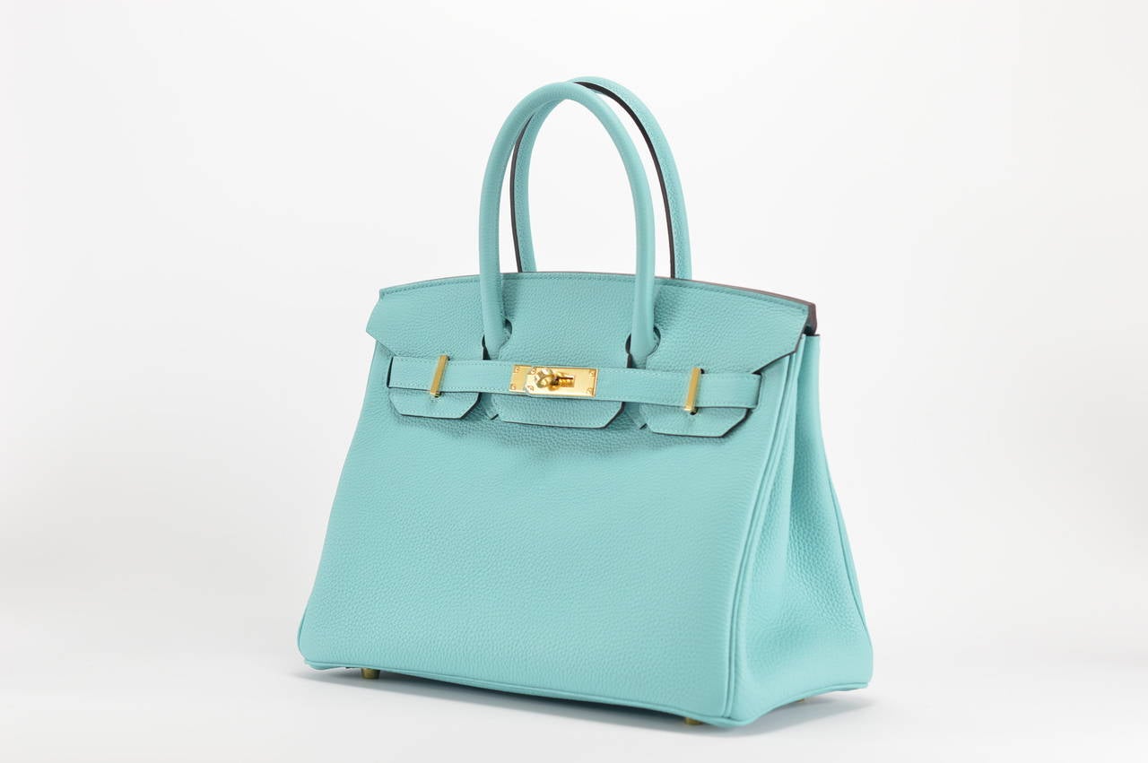 HERMES Handbag BIRKIN 30 TOGO Blue ATOLL GOLD HARDWARE

with the protective plastic intact.
Comes with original box, dustbag, clochette, lock, two keys, felt, rain cover, clochette dustbag, and care booklet.
*Protective felt removed for purposes