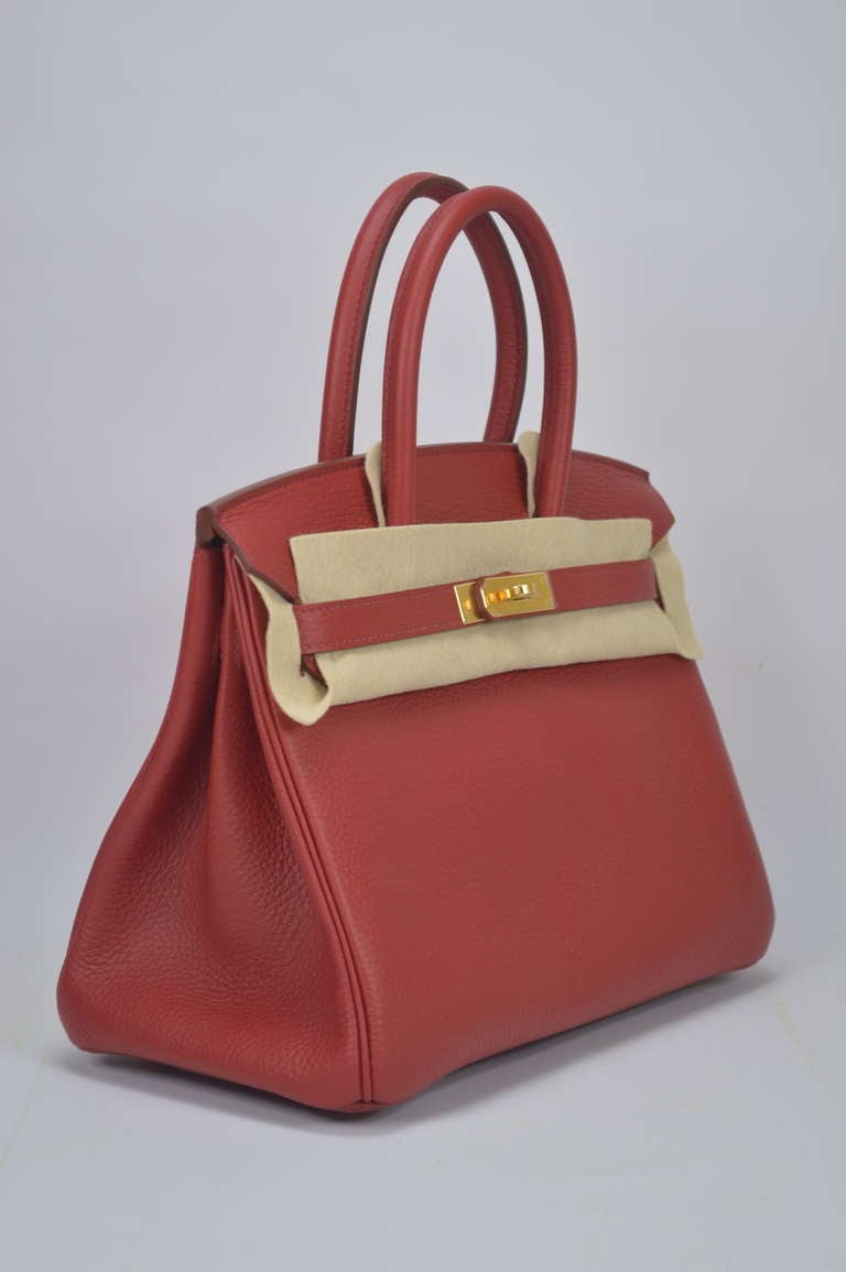 Birkin 30cm, Rouge Grance color, Taurillon Clemence leather, Gold plated Hardware with the protective plastic intact .
Comes with original box, dustbag, clochette, lock, two keys, felt, rain cover, clochette dustbag, and care booklet.
*Protective