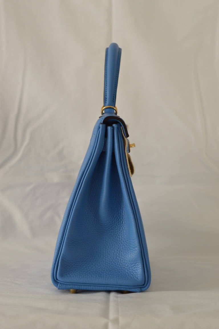 Hermès Handbag Kelly II Retourne  28cm Taurillon Clemence Blue Paradise Gold Hardware.
New color 2014.
Stamp R. Code color 2T.
Hardware with protective plastic intact.
Comes with original box, dustbag, clochette, lock, two keys, clochette