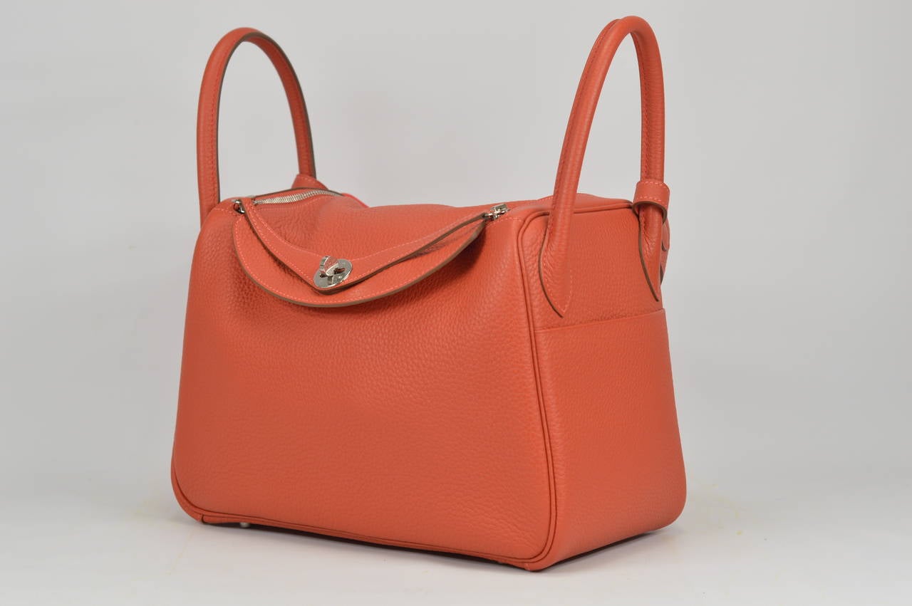 HERMÈS Bag Lindy Taurillon Clemence Leather Sanguine & Rose Jaipur color Palladium Hardware
Stamp R.
Hardware with protective plastic intact.
Comes with original box, dustbag, clochette, lock, clochette dustbag, shoulder strap, shoulder strap