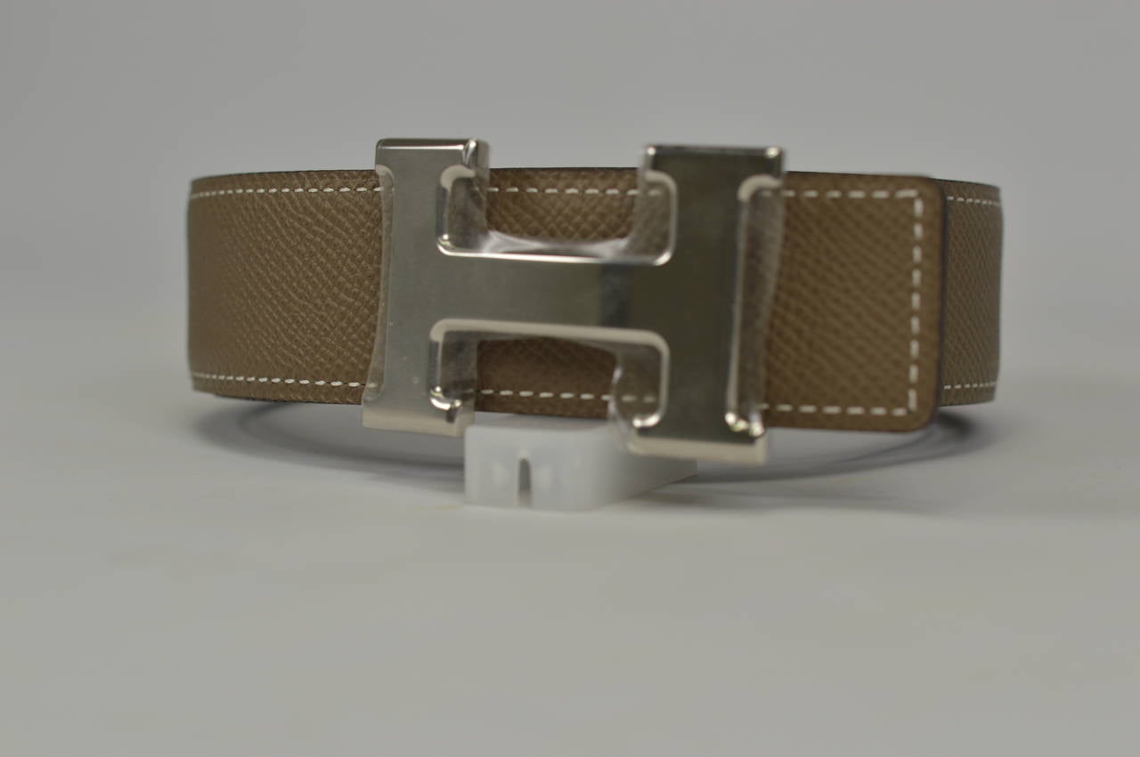 Hermès belt. Reversible leather Noir/etoupe Palladium Hardware
Bought it in Hermès Store in 2014 
Never carried.
Comes with original box and dustbag boucle.

Hermès Store Retail Price 710,00$. We sell it for 610,00$

-Original