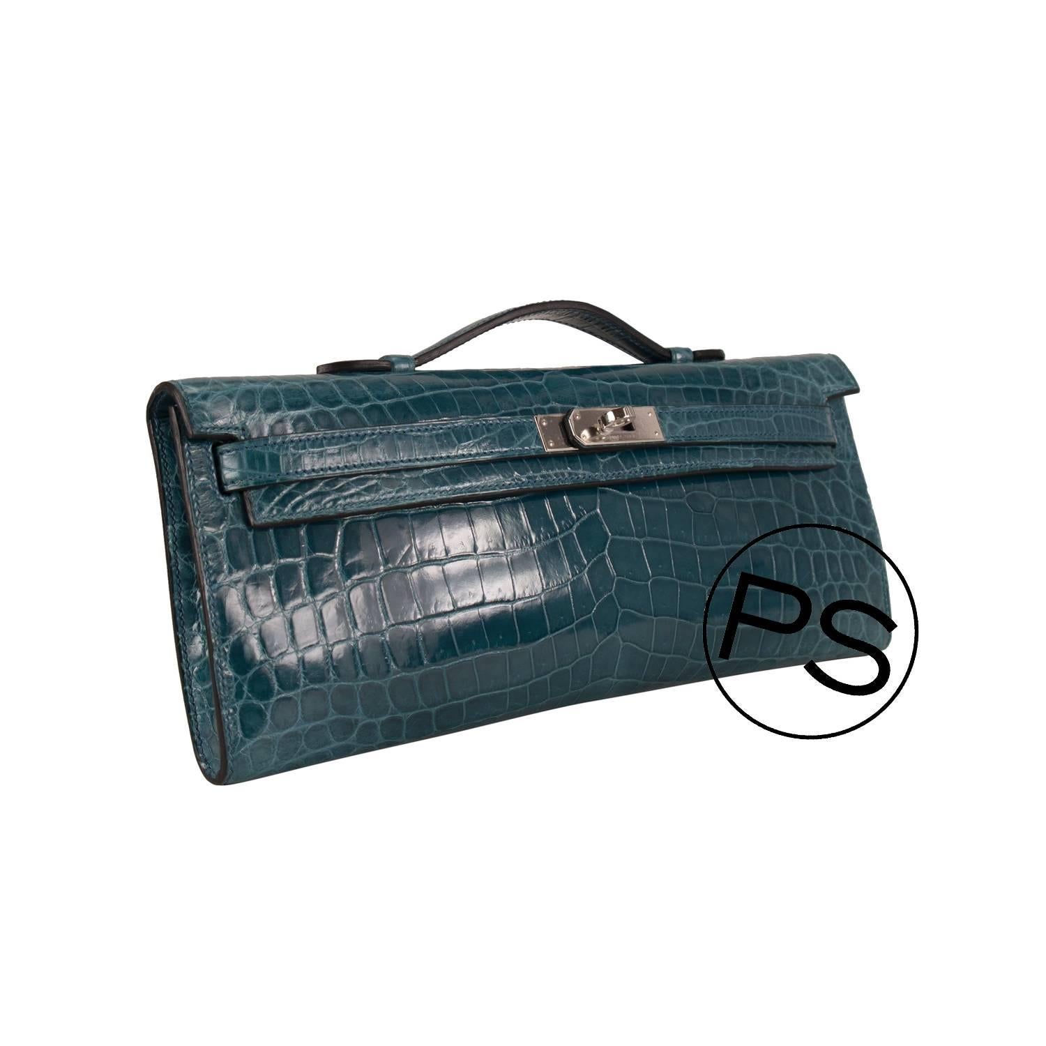 Hermes  Clutch Kelly Cut Crocodile Niloticus Colvert Palladium Hardware 2015.

Bought it in Hermes store in 2015.

Pre-owned and never used.

Model: Kelly Cut.

Color: Black.

Size: 3.5x13.5x2cm (LxHxW)

Details:

With the protective