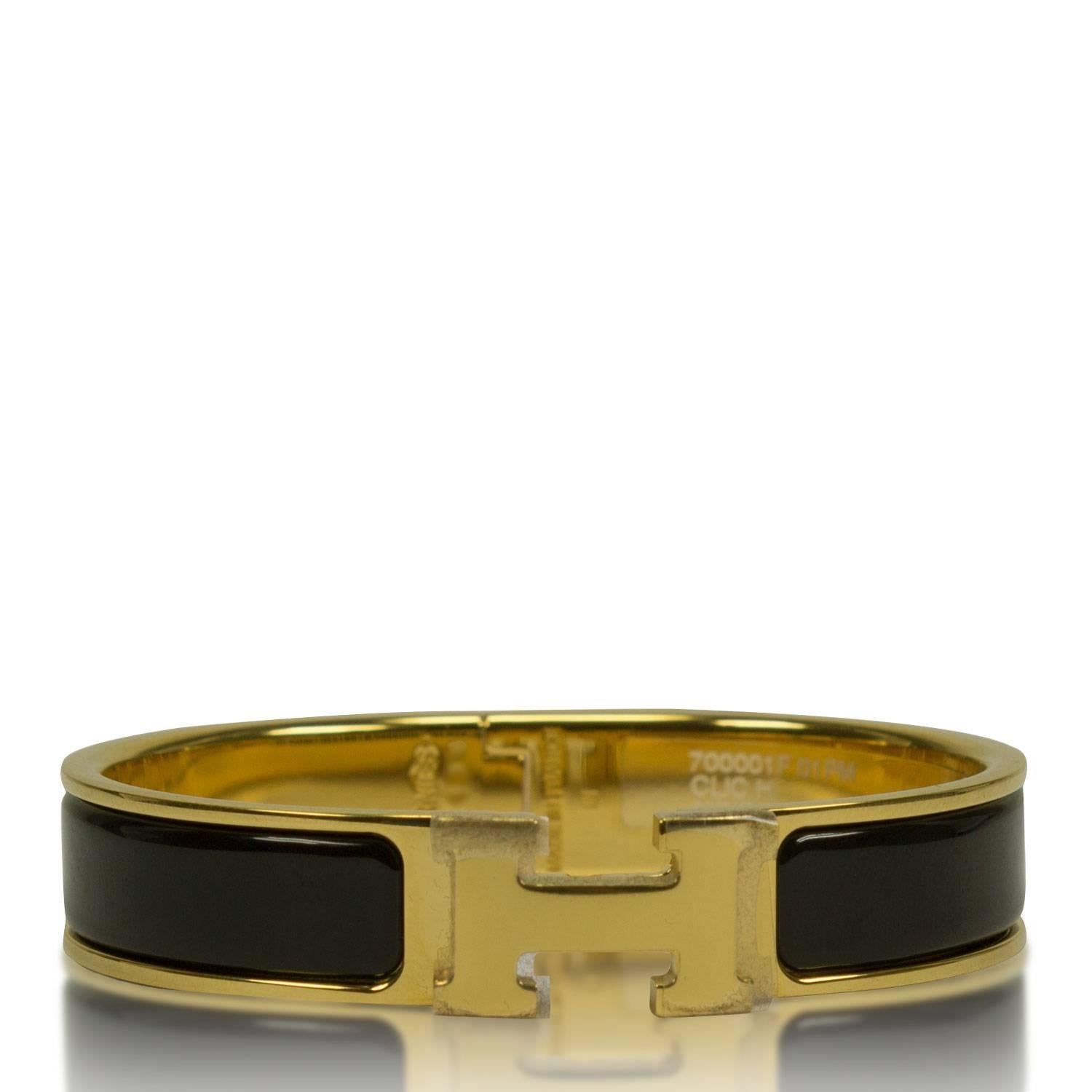 Hermes Bracelet Clic Clac H Gold Enamel Black Color PM Heigth 2016

Pre-owned and never used.

Bought it in Hermes store in 2015.

Model; Clic Clac H.

Size; PM.

Color; 01-Gold Enamel Black.

Oval.
Two diameters. 5.4cm and