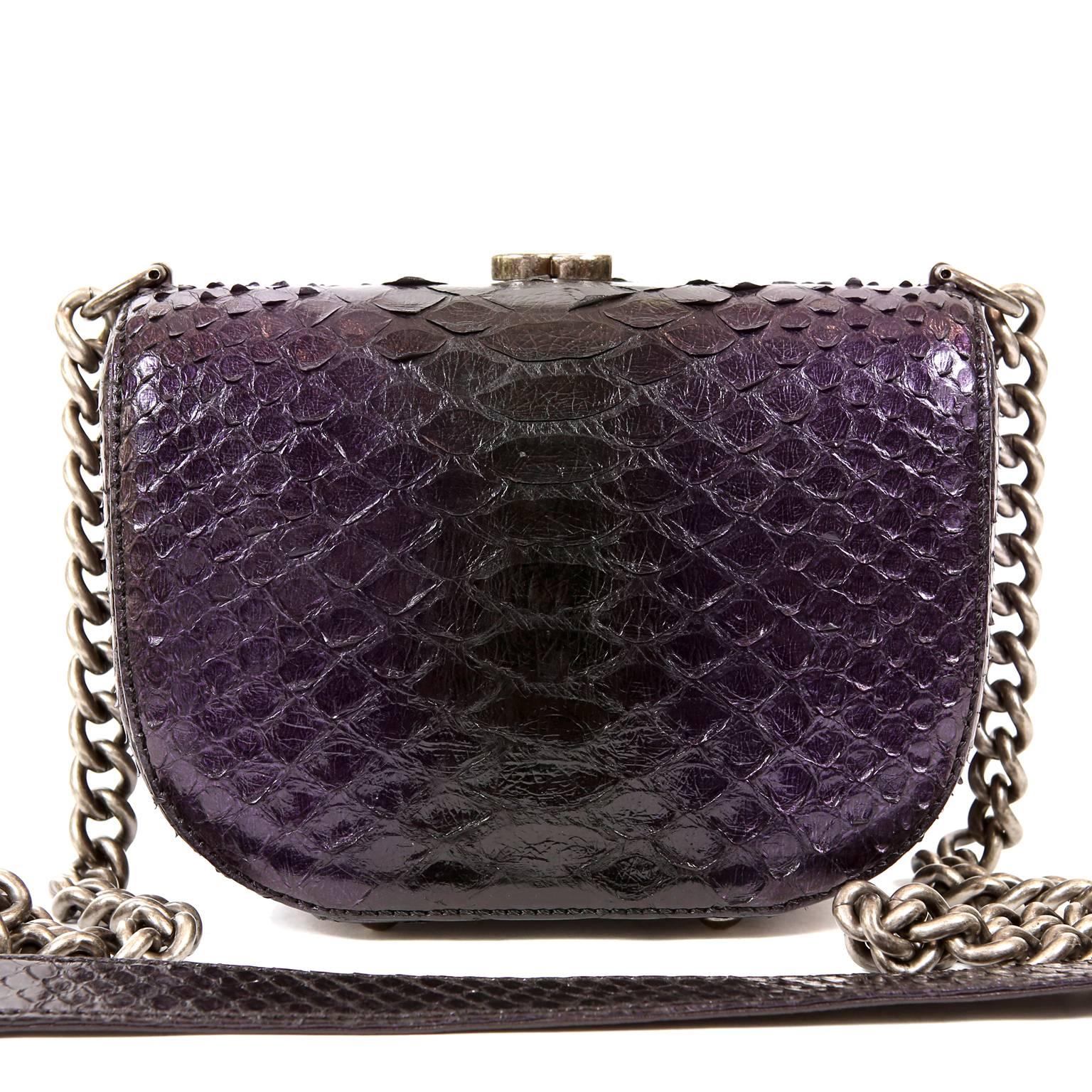Chanel Purple Python Cross Body Bag- PRISTINE
 This exquisite exotic is a collectible piece and certain to hold its value. 
Deep purple python small structured bag has edgy ruthenium framing and CC clasp.  Opening at the top, the purple fabric ling