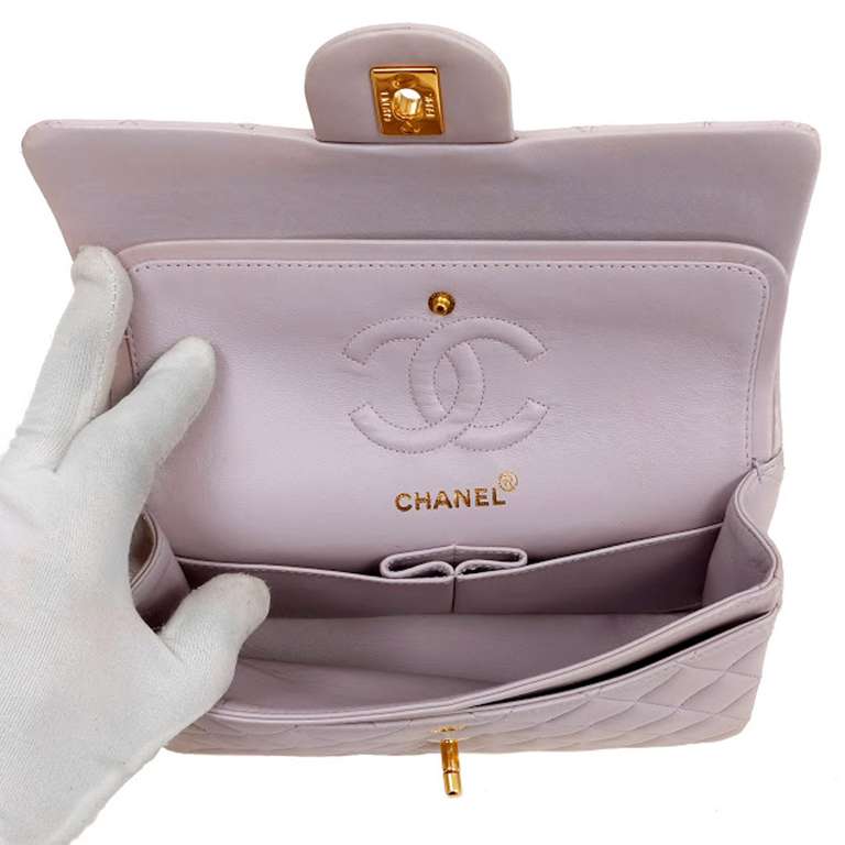 One Chanel Classic Lambskin Double Flap Bag in Lavender. It is in pristine condition, appearing possibly unworn. This bag measures 9.25