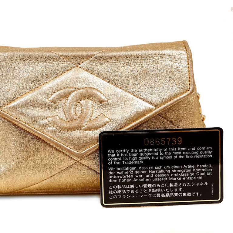 One Chanel Vintage Gold Camillia Evening bag. It is an excellent condition. This bag measures 7