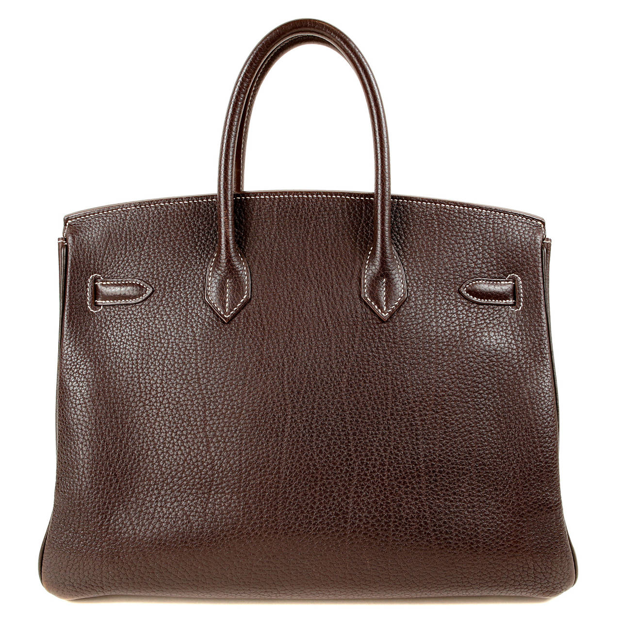 Hermès Ebene 35 cm Fjord Birkin is beautifully pristine.   In rich deep brown Ebene with Palladium hardware, this is a stunning Birkin.  
Hermès bags are considered the ultimate luxury item the world over.  Hand stitched by skilled craftsmen,