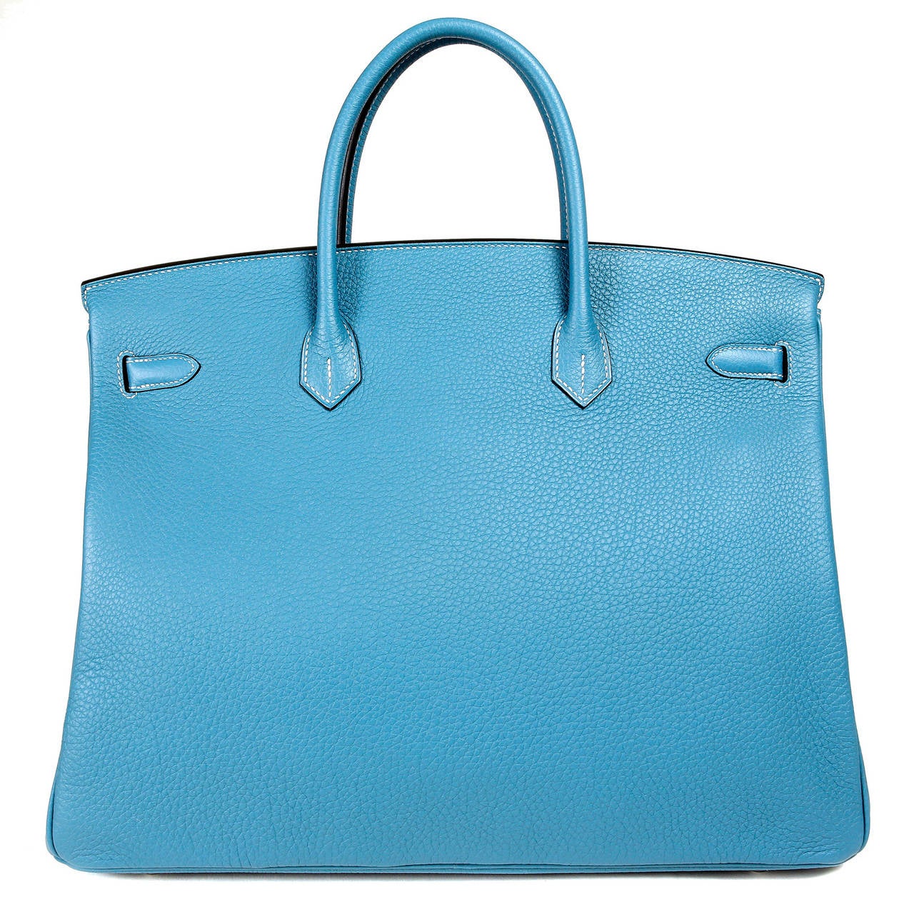 Hermès Blue Jean Togo 40 cm Birkin - PRISTINE unworn condition with the plastic still attached to the hardware.   

Hermès bags are considered the ultimate luxury item the world over.  Hand stitched by skilled craftsmen, wait lists of a year or