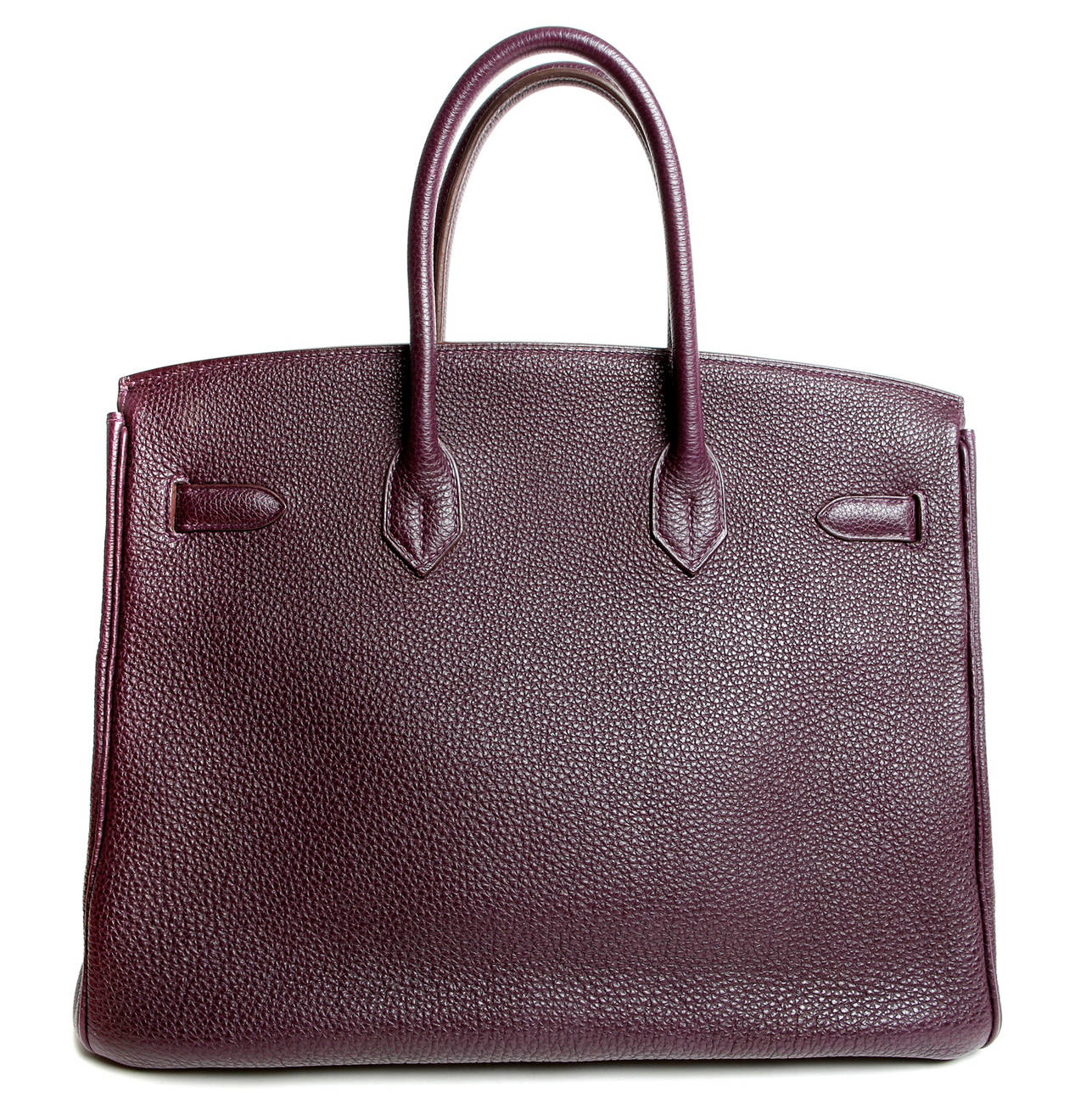 Hermès Raisin Togo Leather 35 cm Birkin  in near pristine condition

Wait lists for the handcrafted Birkin often exceed a year or more.  Raisin paired with Palladium hardware is an excellent way to introduce a hint of color to a wardrobe without