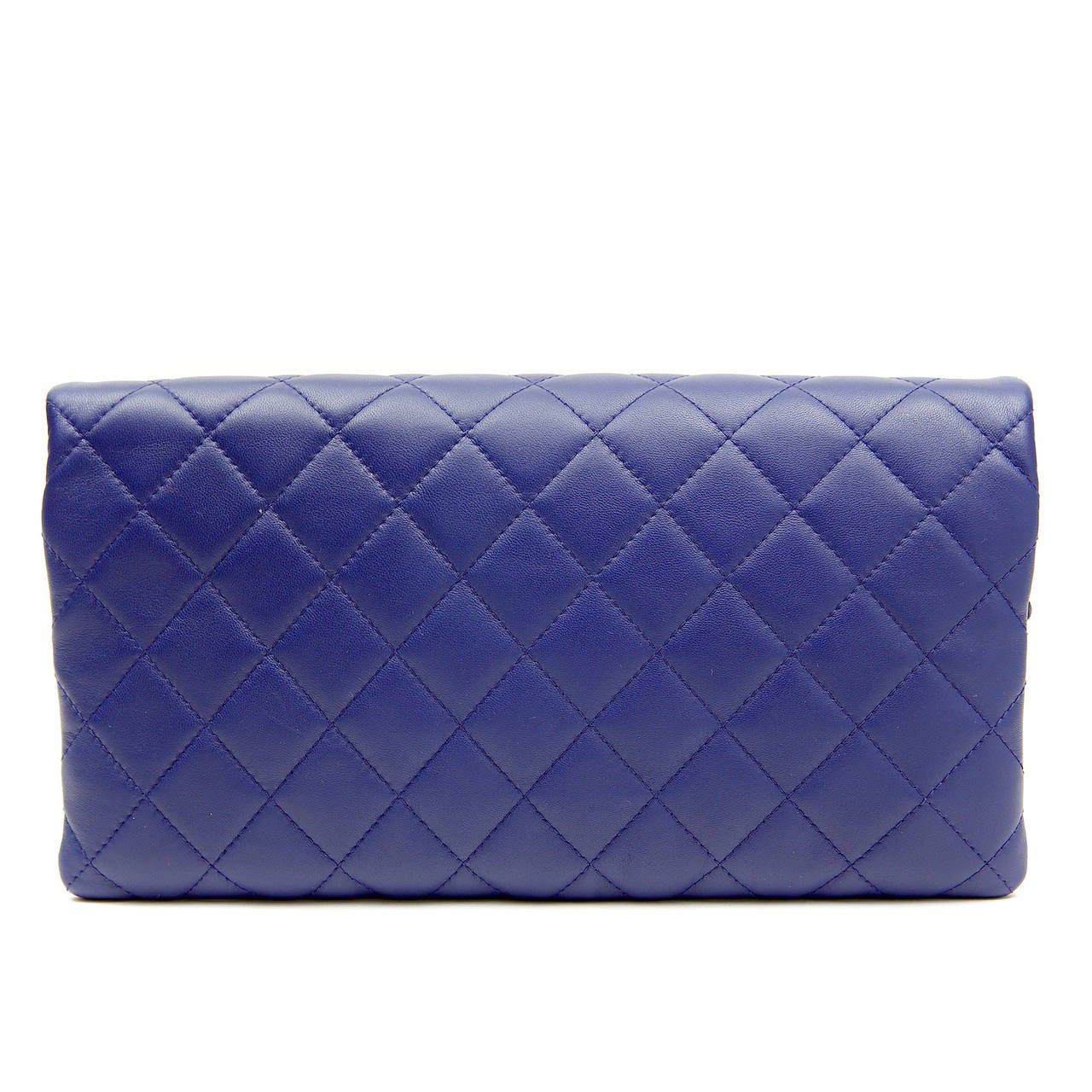 Chanel Purple Leather Fold Over Clutch- PRISTINE, never before carried. 
  A classic addition to any wardrobe, it adds a welcome pop of color to any ensemble.
 
Purple leather is quilted in signature Chanel diamond stitched pattern.  The top