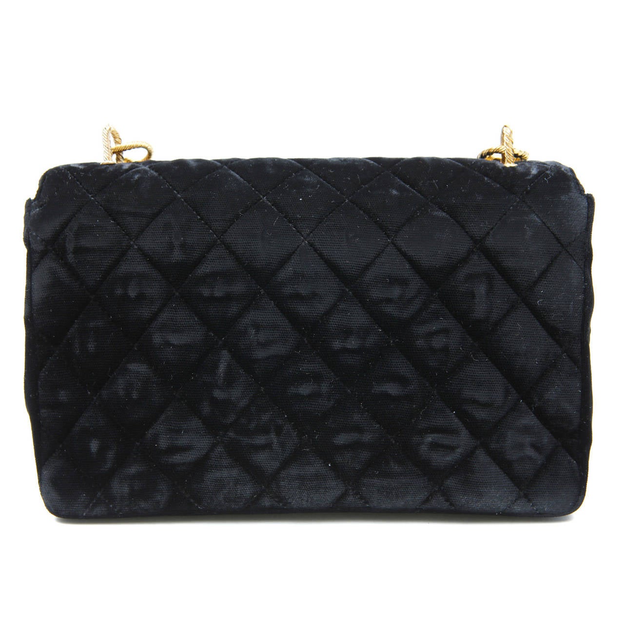 Chanel Black Vintage Velvet Gripoix Evening Bag - pristine condition; a beautiful collectible.  
The classic style exudes elegance designed in rich velvet with opulent gemstones.
 
Black velvet small bag is quilted in signature Chanel diamond