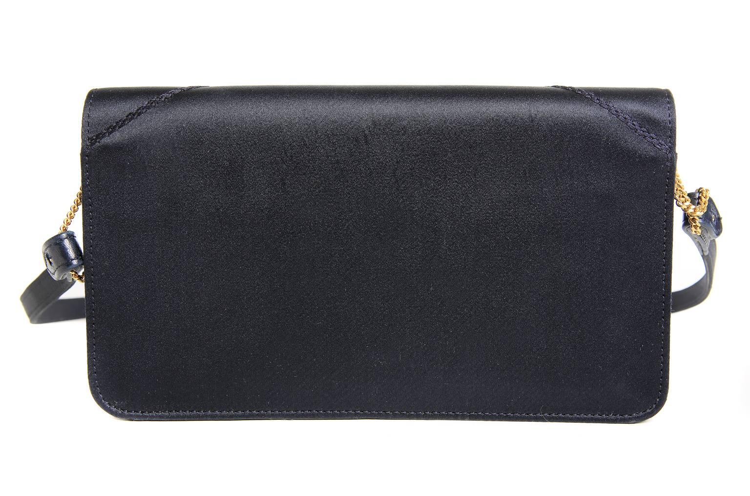  Hermès Navy Satin Evening Bag- pristine condition, possibly carried one time.  Beautifully designed, it can be carried as a clutch or with a shoulder strap that easily connects via dainty gold chains.  A beautiful bag on its own, it is also a must
