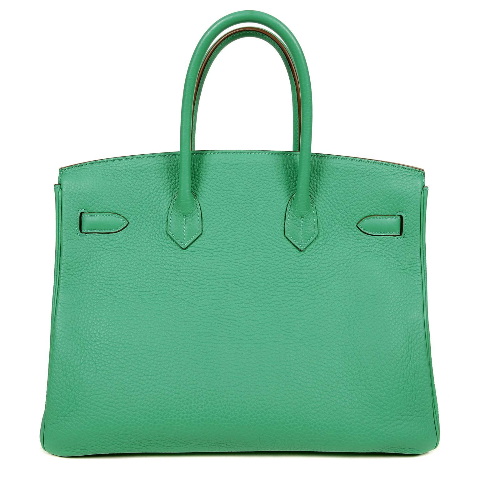  Hermès Menthe Clemence 35 cm Birkin is in pristine unworn condition.  Plastic on hardware.
Hand stitched by skilled craftsmen, wait lists of a year or more are commonplace for the Hermès Birkin. Menthe is a vibrant green- a true POP of color