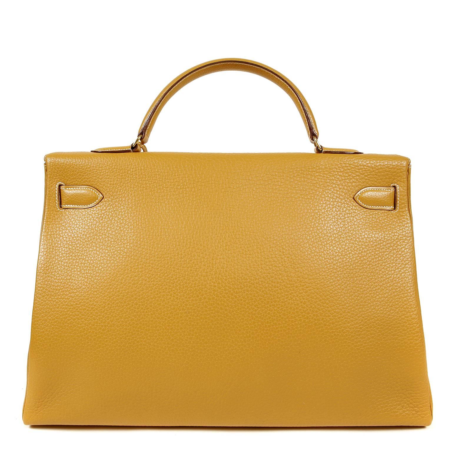 Hermès Cumin Togo 40 cm Kelly- Excellent condition 
This is a rare color and size; a spectacular find for collectors.  
  Hermès bags are considered the ultimate luxury item worldwide.  Each piece is handcrafted with waitlists that can exceed a