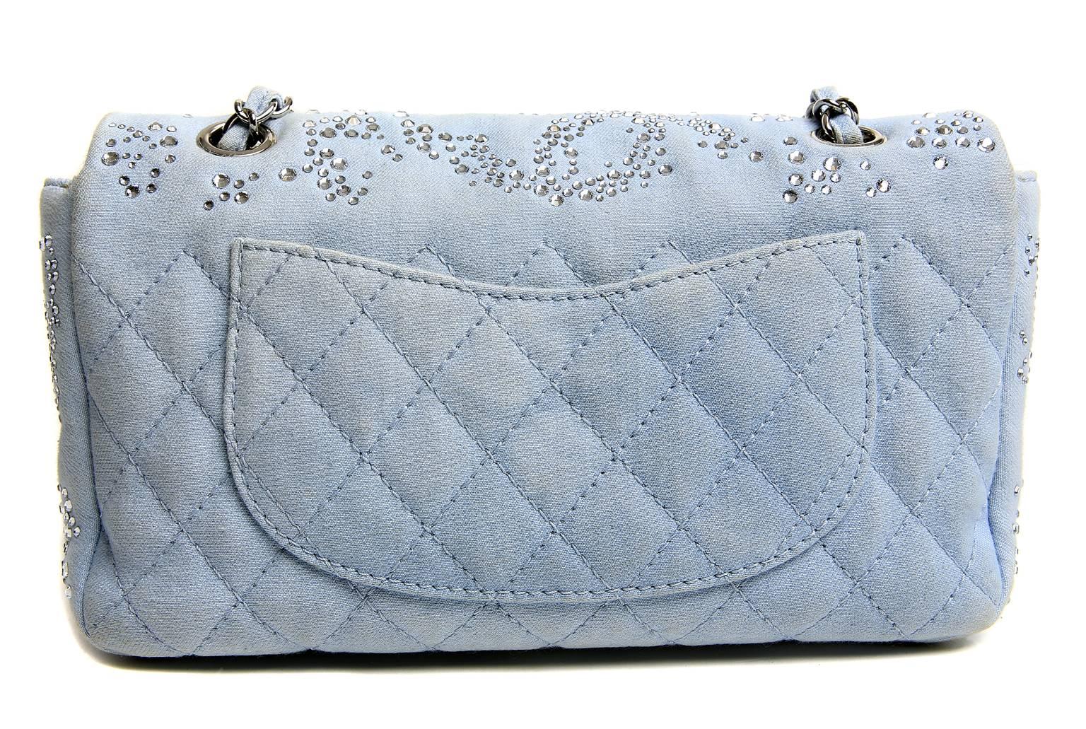Chanel Powder Blue Swarovski Crystal Classic Flap- EXCELLENT
Collectible Chanel in beautiful condition.  The classic design is enhanced with a glittering array of the Austrian crystals; eye catching and unique.
 
Powder blue fabric single flap