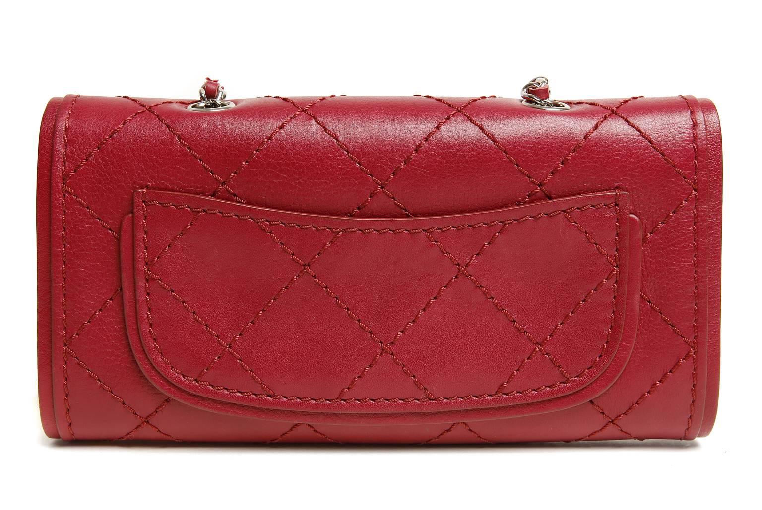 Chanel Red Leather Convertible Cross Body Bag- PRISTINE, Never Before Carried
  Similar to the WOC, this uniquely versatile Chanel can be carried as a clutch, cross the body, or tossed inside another bag as a wallet. 
 
Lipstick red leather is