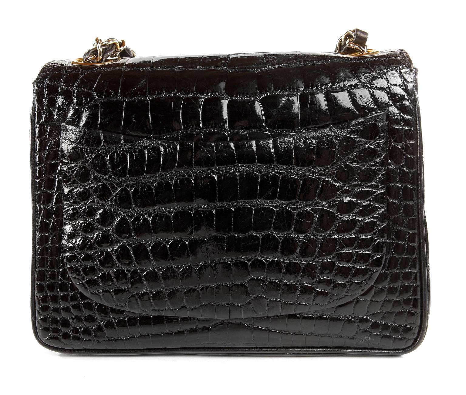 Chanel  Black Crocodile Mini Classic Flap Bag- PRISTNE Vintage Condition
 The most exclusive of all exotics, the Mini Classic in black crocodile with gold hardware is a collector’s dream. 
 
Sleek black crocodile skin has a beautiful glossy sheen