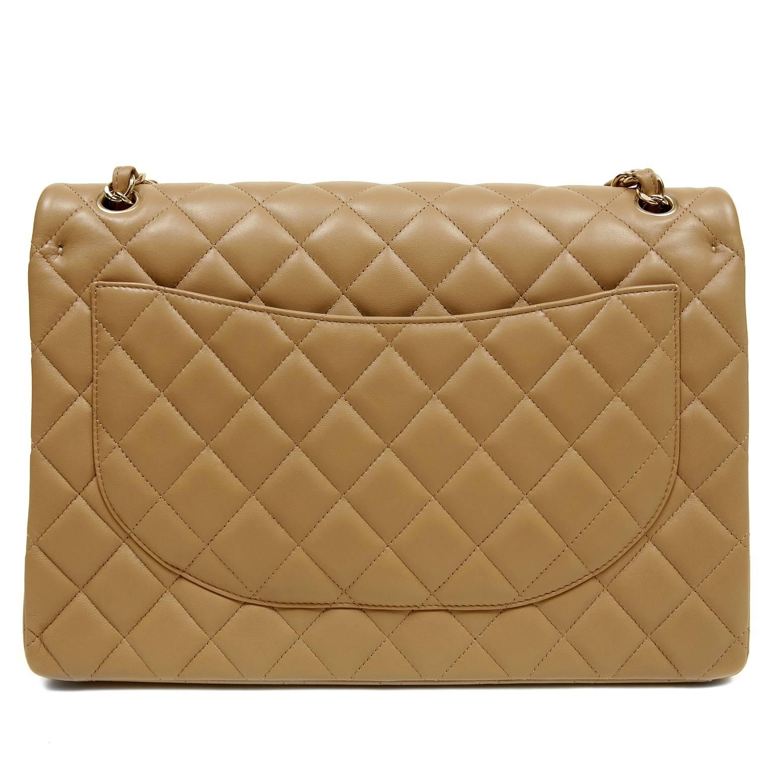 Chanel Beige Lambskin Maxi- PRISTINE; Never Carried
  A must have for any wardrobe in neutral camel with gold hardware, the Maxi is perfect for year round enjoyment.

Beige lambskin is quilted in signature Chanel diamond stitched pattern.  Gold