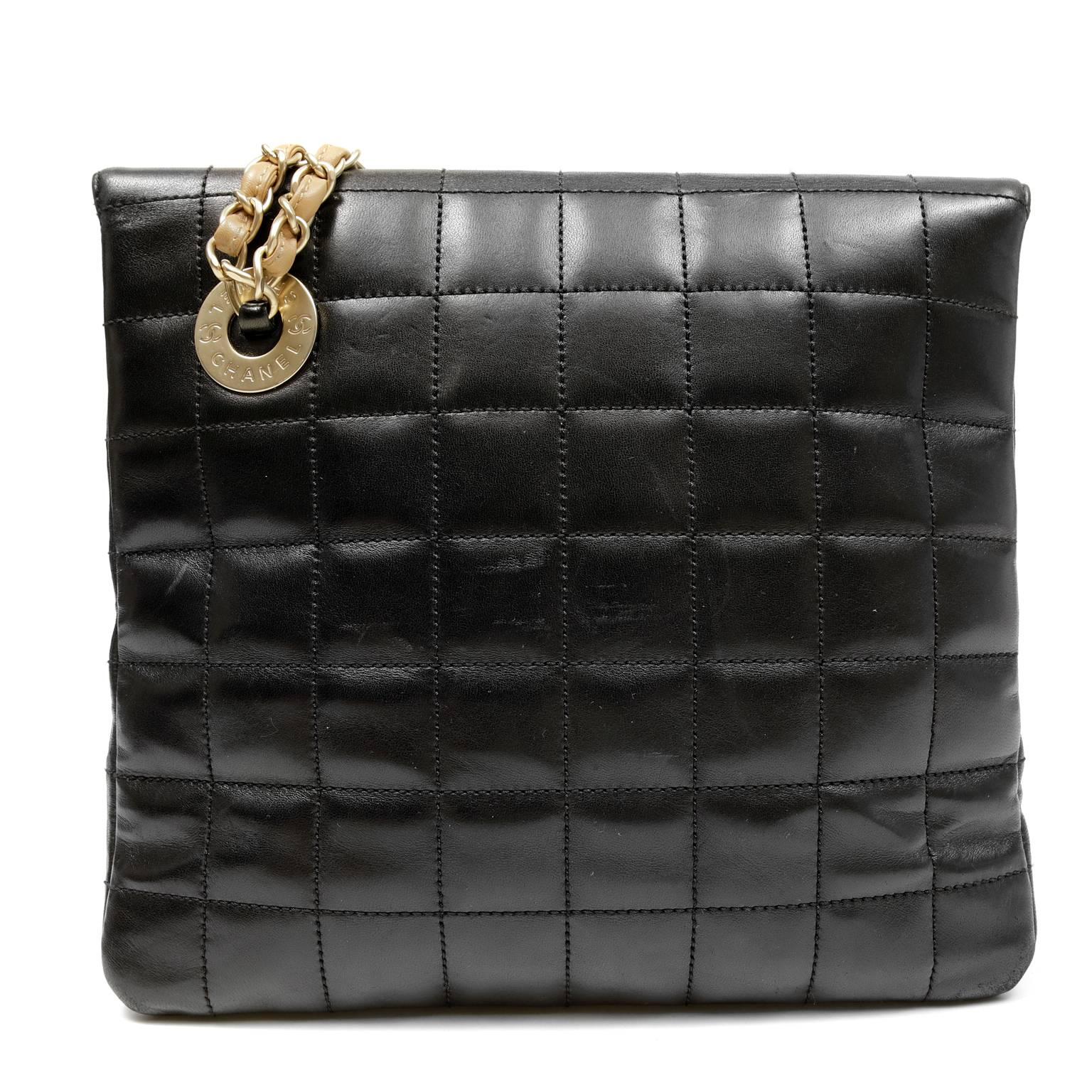 Chanel Black Leather Shoulder Bag- PRISTINE
 Designed with an off center mademoiselle twist lock and contrasting straps, this unique (yet totally wearable) Chanel is a must have for any collection.  

Black leather is quilted in chocolate square