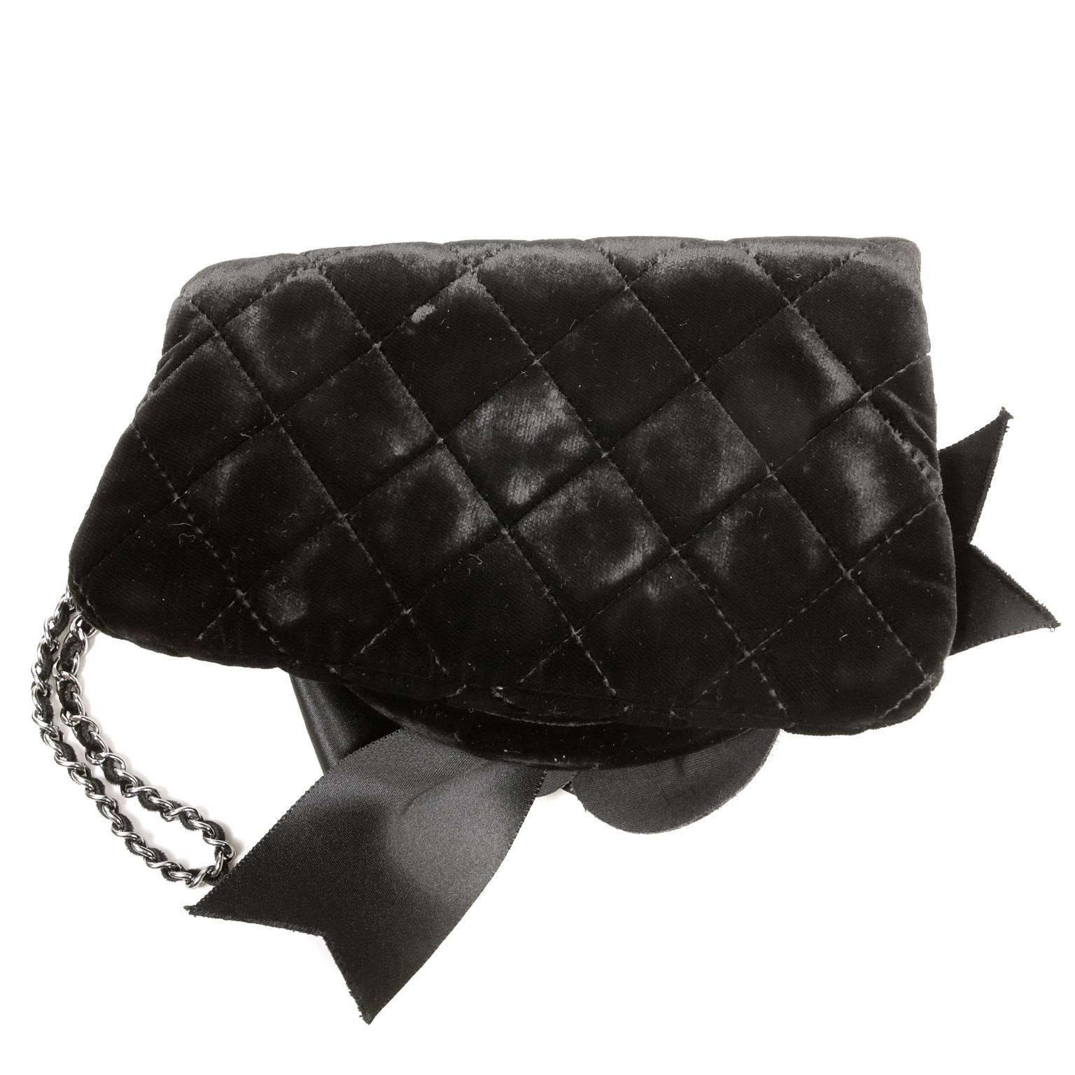 Chanel Black Velvet Camellia Evening Bag- Pristine
The exquisite wristlet is just right for carrying the essentials and is a must for any collection.
Black velvet pouch is quilted in signature Chanel diamond pattern.  An oversized velvet camellia