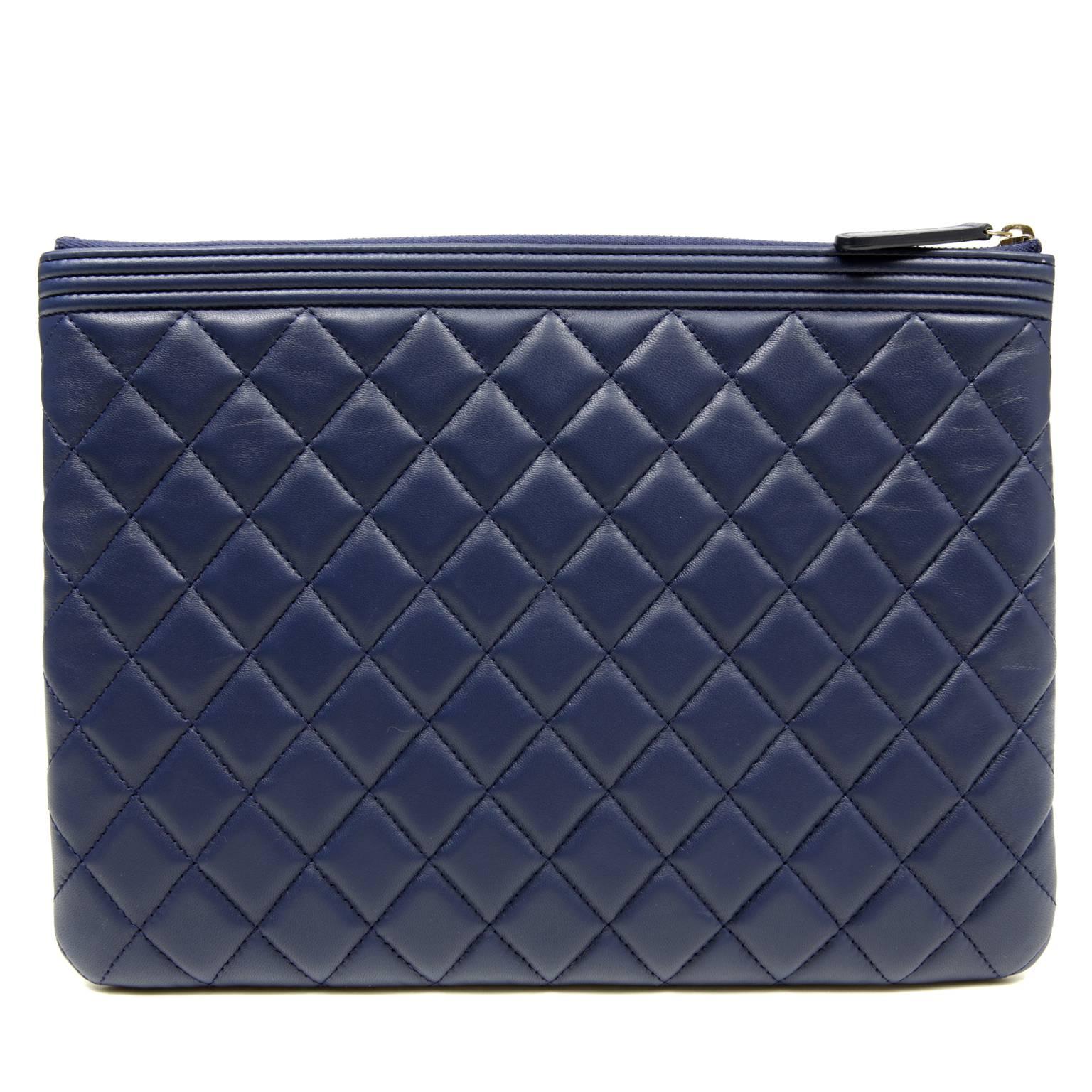 Chanel Blue Leather Boy Portfolio-  PRISTINE; appearing never before carried. 
 
Blue leather is quilted in signature Chanel diamond stitched pattern.  Gold tone interlocking CC Boy plaque.  Zippered top with quilted interior.  Made in Italy. 