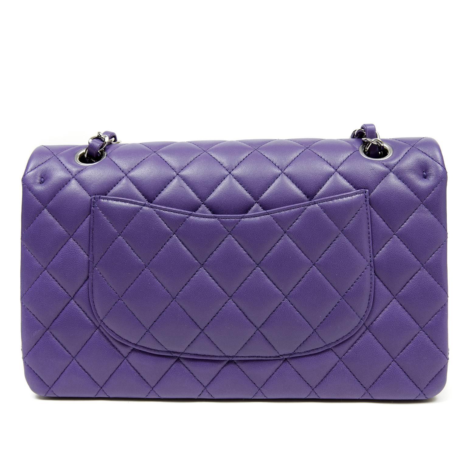Chanel Purple Lambskin Classic Double Flap- PRISTINE, Never Carried
 The medium silhouette is extremely versatile and this stunning color is a must have for purple lovers.
Regal purple lambskin is quilted in signature Chanel diamond stitched