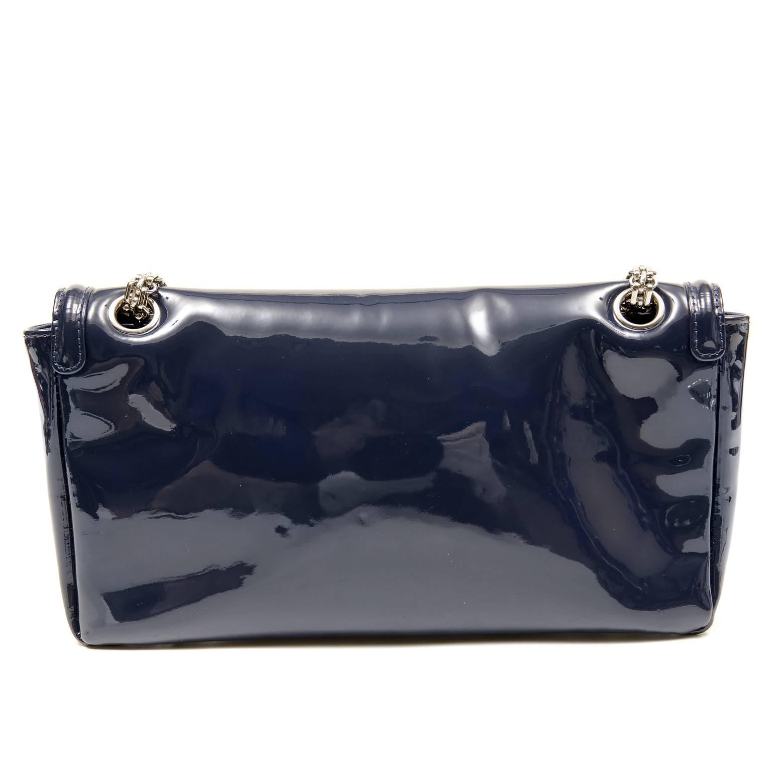 Chanel Navy Patent Multi Chain Reissue Flap Bag- PRISTINE, appearing never  carried. 
 The artfully linked chain strap adds creative flair to this collectible Chanel.  
Deep navy blue patent leather has a glossy and durable finish.  Silver
