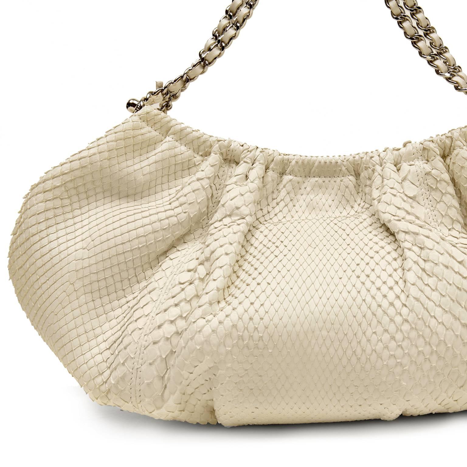 Chanel Ivory Python Hobo - PRISTINE 
 The simple silhouette really allows the exotic skin to take center stage and be the focus of this stunning piece.  
Creamy white python skin half-moon hobo is gathered along the top collar with a magnetic snap