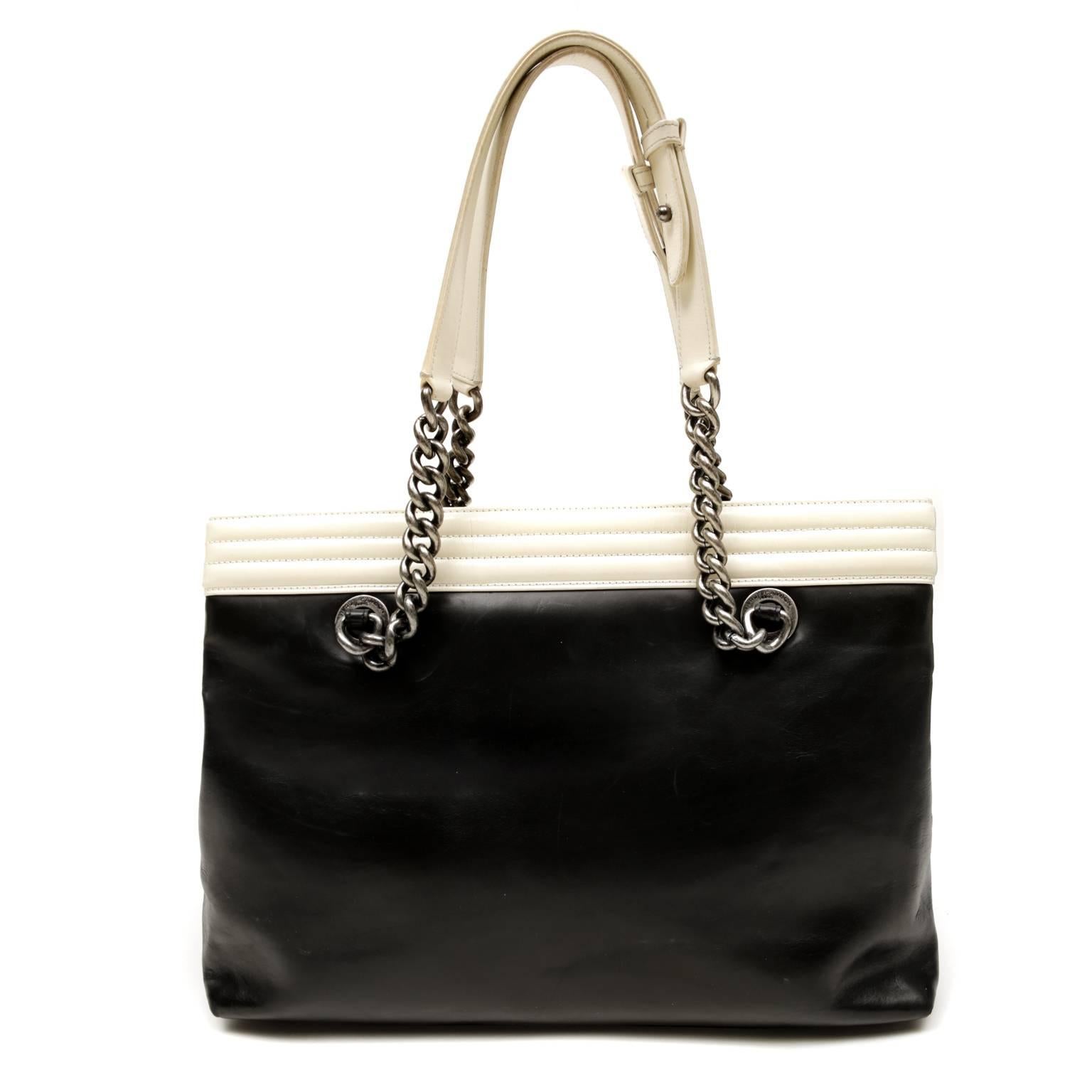 Chanel Black and Cream Leather Boy Bag Shopper- PRISTINE  
The classic silhouette gets an updated look with contrasting trim, edgy ruthenium hardware and the unique Boy bag clasp.

Glossy black leather tote has contrasting cream leather top edge