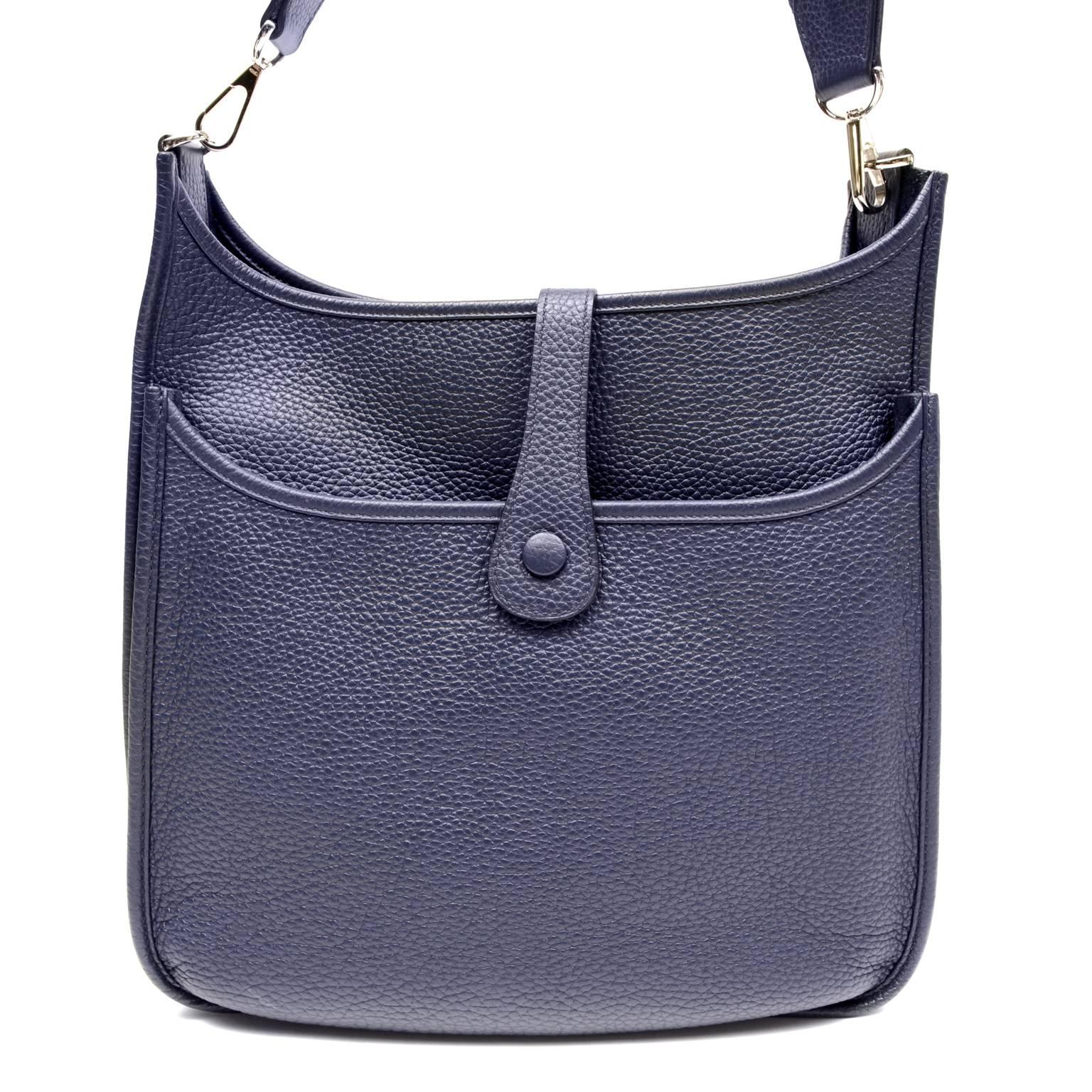 Authentic Hermès Blue Colvert Evelyne III GM - Pristine Condition
  The dark blue shade is a welcome change from basic black yet easily mingles blends with nearly any other color
The Evelyne silhouette is inspired by an equestrian groom’s tool