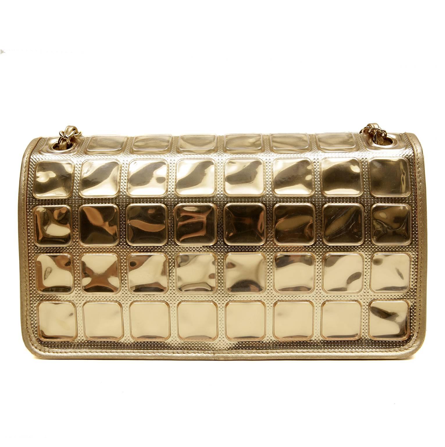 Chanel Gold Ice Cube Classic Flap- PRISTINE
 The classic Chanel silhouette gets a futuristic update with a mod mirrored façade.
Golden mirrored squares cover the front and rear of this classic flap.  The sides and bottom are in matte metallic