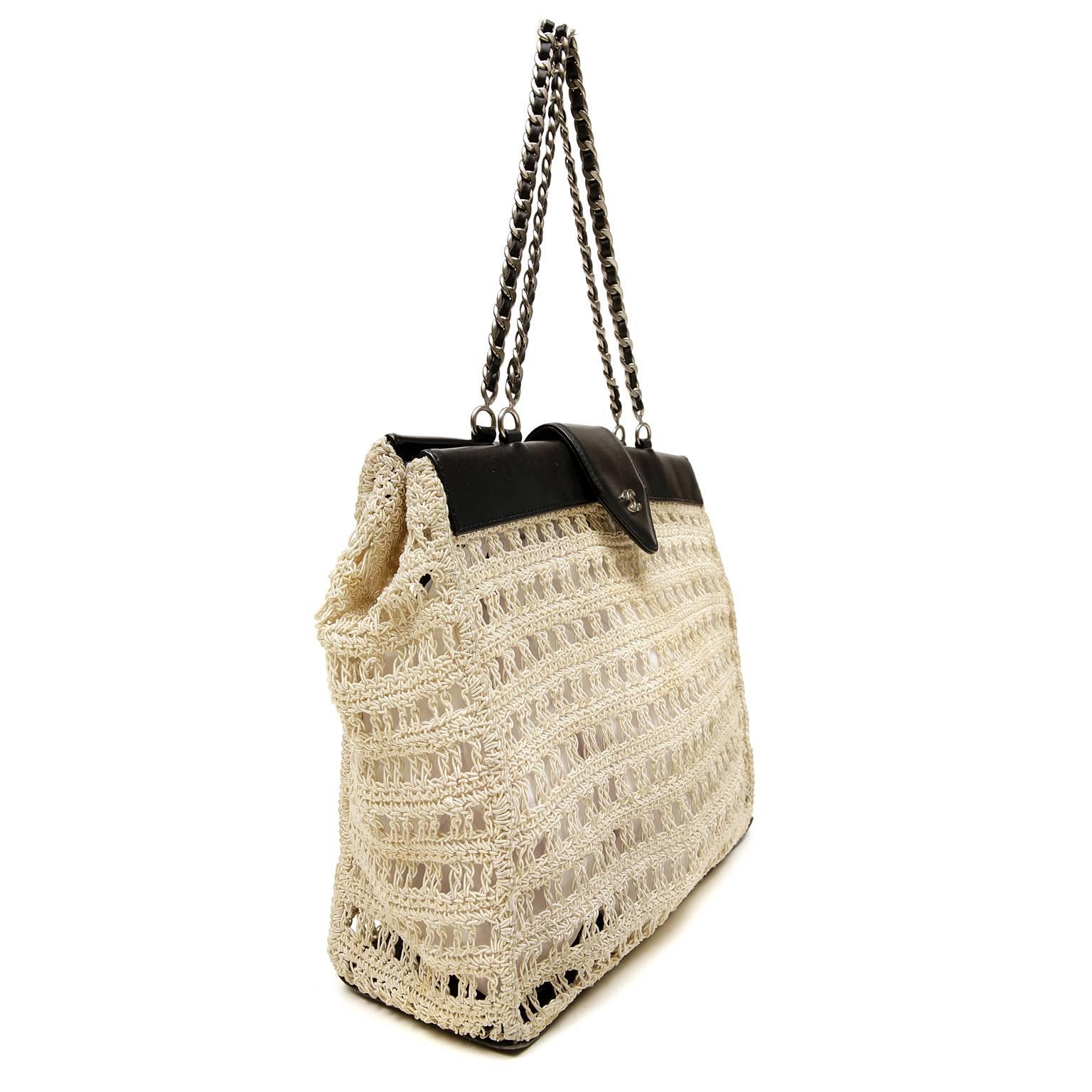 Chanel Beige Crocheted Tote- PRISTINE
  The airy relaxed nature only adds to the extreme chic of this perfect warm weather bag.  
Beige crocheted body is trimmed with black leather and accented with dark silver hardware.  The unlined interior has