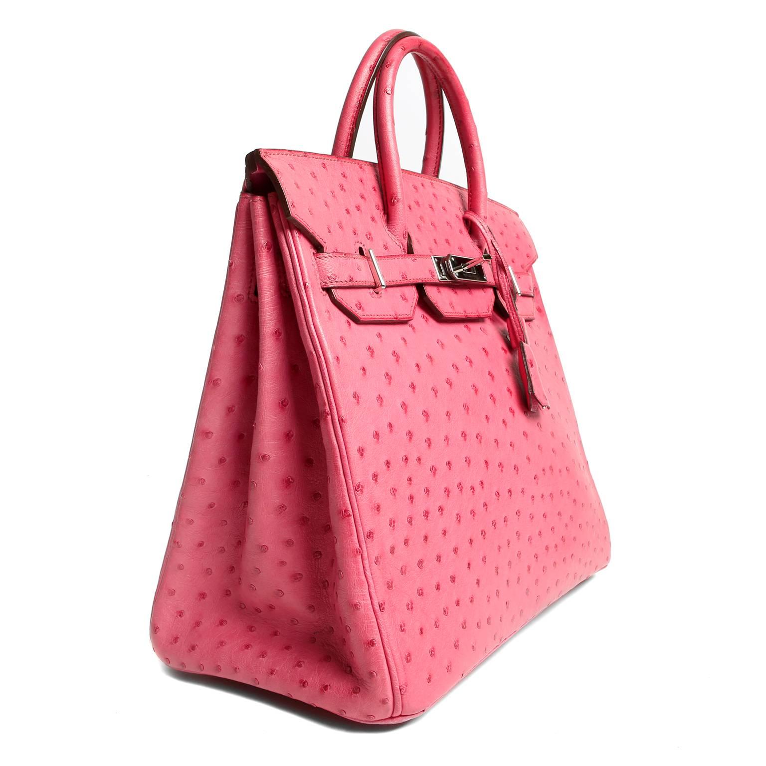 Hermès 32 cm Fuchsia Pink Ostrich HAC Birkin- PRISTINE
Considered the ultimate luxury item the world over and hand stitched by skilled craftsmen, wait lists of a year or more are commonplace for Hermès bags. The HAC (Haut a Courroies or “high