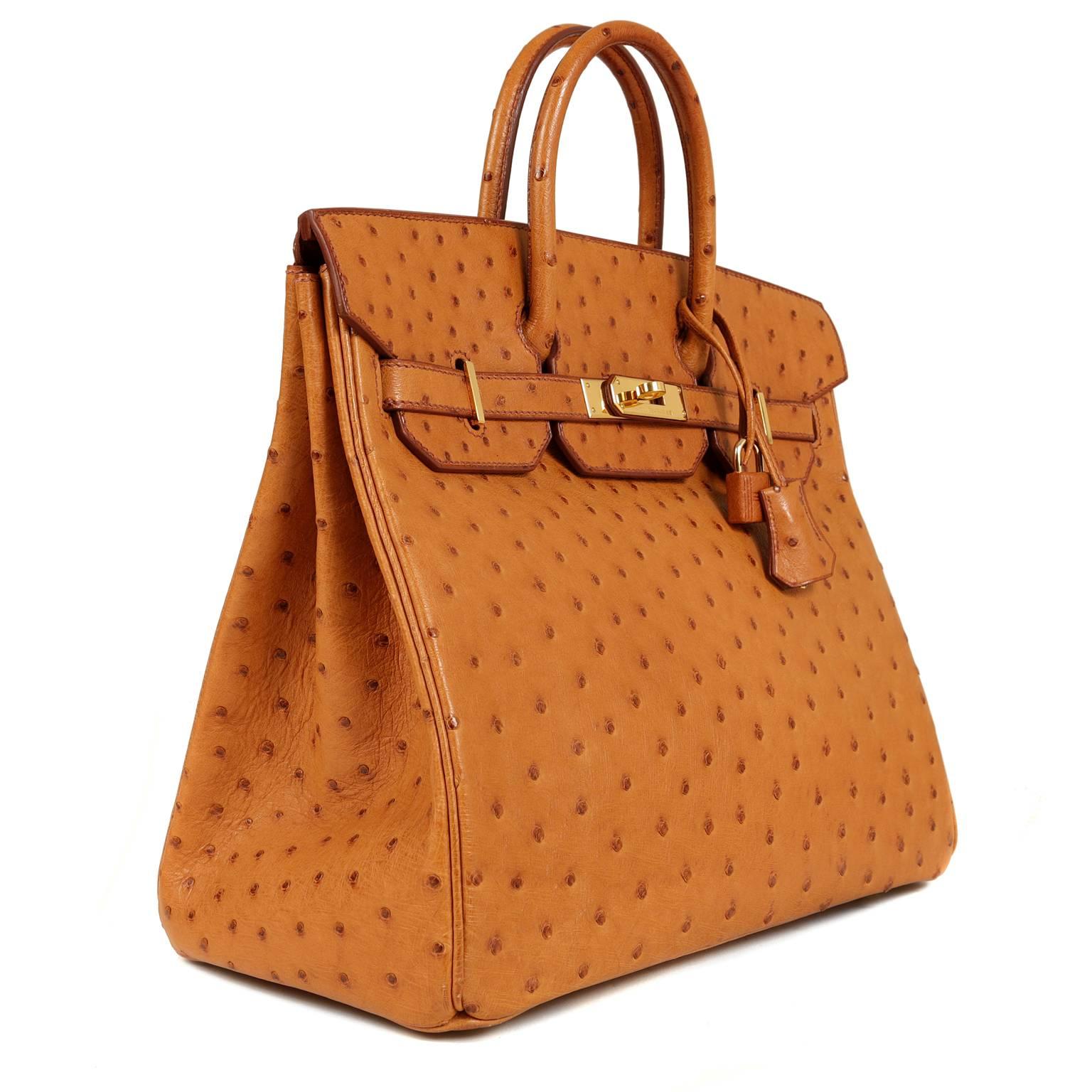 Hermès Saffron Ostrich 32 cm HAC- Nearly Pristine

Considered the ultimate luxury item the world over and hand stitched by skilled craftsmen, wait lists of a year or more are commonplace for Hermès bags. This particular piece is in Saffron