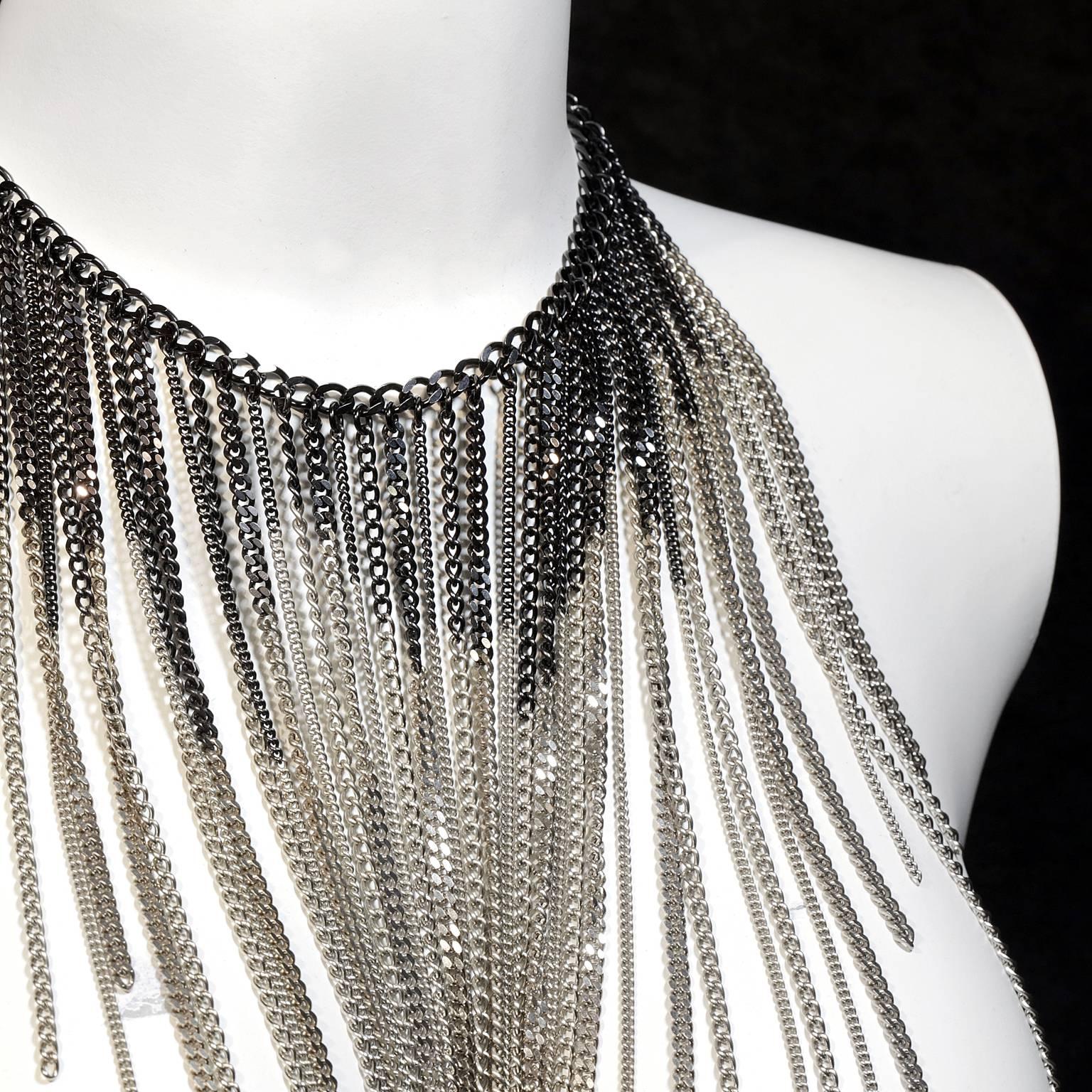 Chanel Multi Chain Bib Necklace- PRISTINE
  Dripping chains in ruthenium and gold make a definite statement. 
Edgy ruthenium and gold chains hang at differing lengths creating a dramatic visage.  Adjustable length.  Lobster claw closure.  
