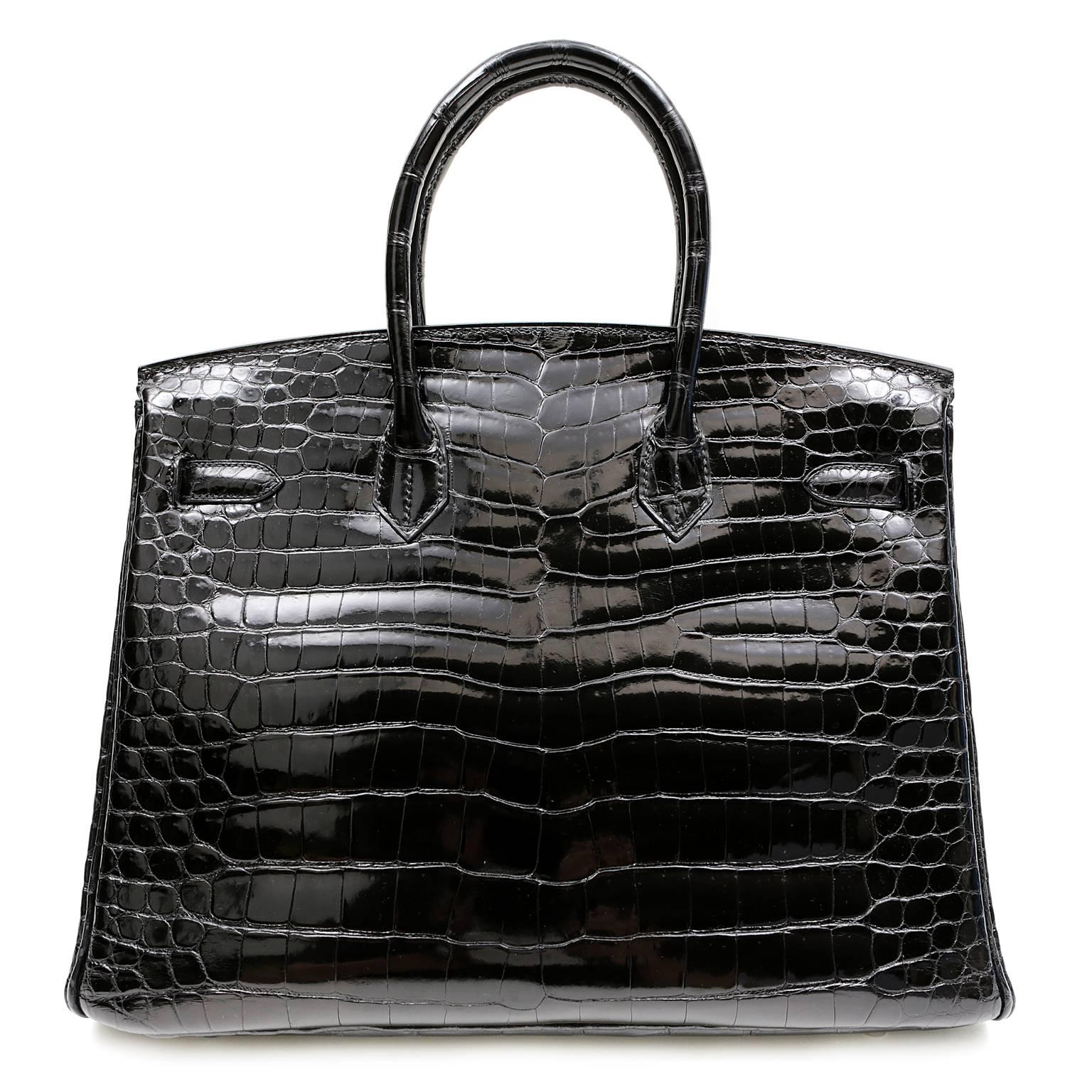 Hermès Black Porosus Crocodile 35 cm Birkin- PRISTINE. Never Carried; plastic on hardware.
    Hermès bags are considered the ultimate luxury item the world over.  Hand stitched by skilled craftsmen, wait lists of a year or more are commonplace