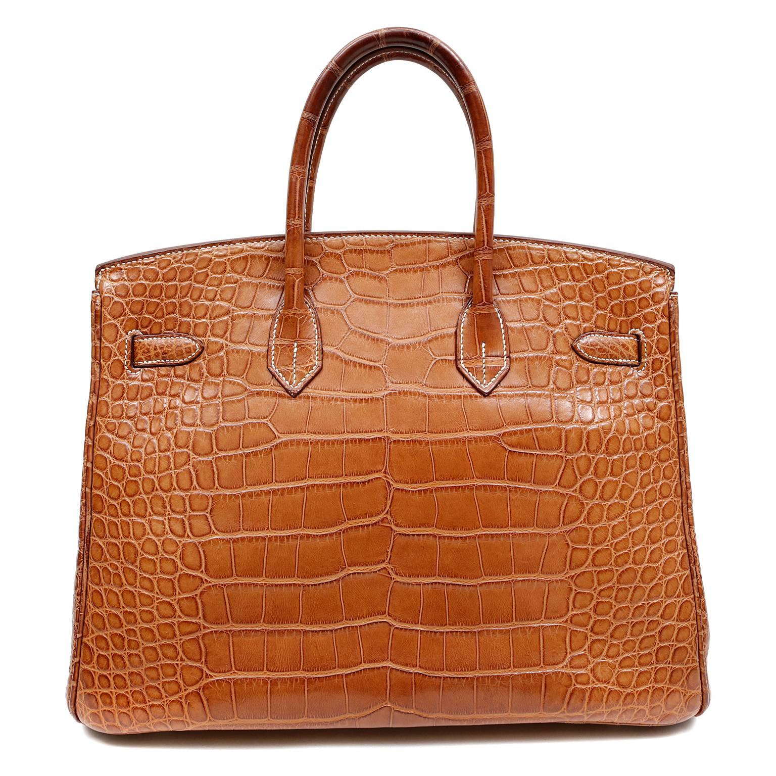 Hermès Gold Matte Alligator Birkin Bag, 35 cm- PRISTINE
   Hermès bags are considered the ultimate luxury item the world over.  Hand stitched by skilled craftsmen, wait lists of a year or more are commonplace for the leather versions.  An exotic