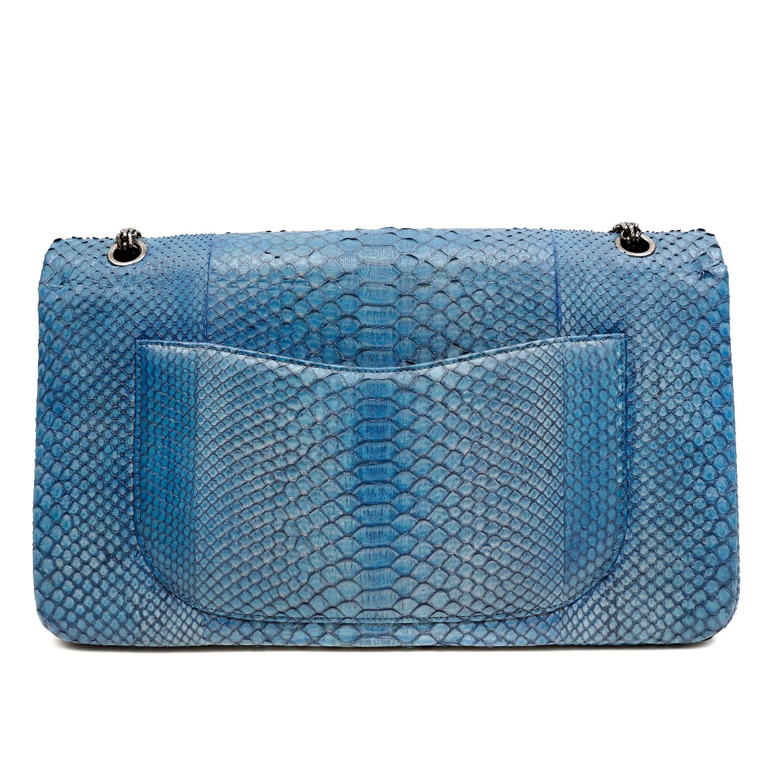 Chanel Grey Blue Python Maxi Double Flap- PRISTINE
The stunning exotic skin is highlighted perfectly with ruthenium hardware.  This is a must have piece for any collection.  
Glorious blue python has grey striations and outlines each scale