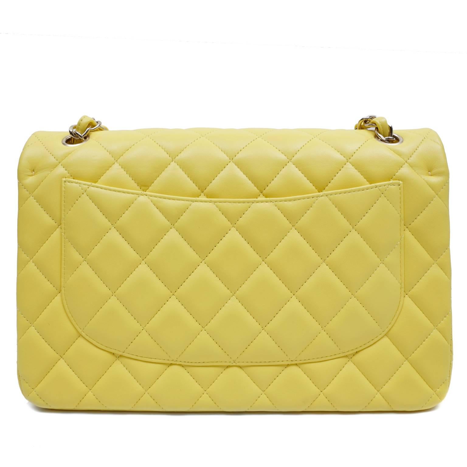 Chanel Yellow Leather Jumbo Classic Flap- PRISTINE
  The classic silhouette draws every eye in the sunny lemon yellow hue.  
Cheerful lemon yellow leather is quilted in signature Chanel diamond stitched pattern.  Silver interlocking CC twist lock