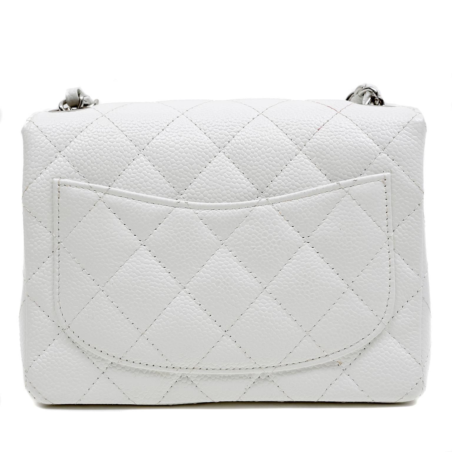 Chanel White Caviar Leather Mini Classic Flap- PRISTINE
Certain to be a go to piece for day or evening in any summer wardrobe, the Mini Classic in white is a must have. 
White caviar leather is textured and very durable.  Signature Chanel diamond